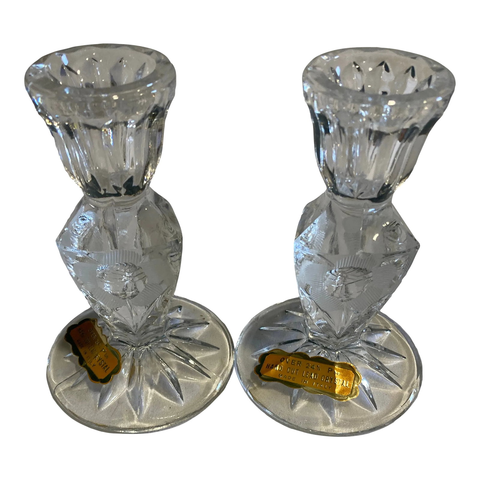 Vintage Italian Hand Cut Crystal Candlesticks, a Pair: his pair of vintage cut crystal candle holders by Rosa Di Roma showcases Italian craftsmanship with hand-cut detailing and a classic faceted form. The clarity and weight of the lead crystal give
