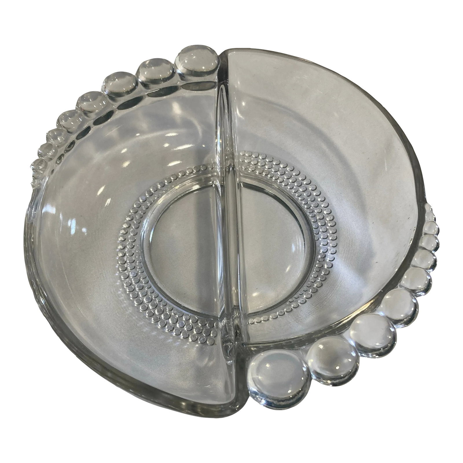 Vintage Duncan Miller Candlewick Divided Relish Dish: This divided relish dish by Duncan Miller in the signature Candlewick pattern features the classic beaded edge and beaded ring detailing pressed into clear glass. The two-compartment design suits oliv