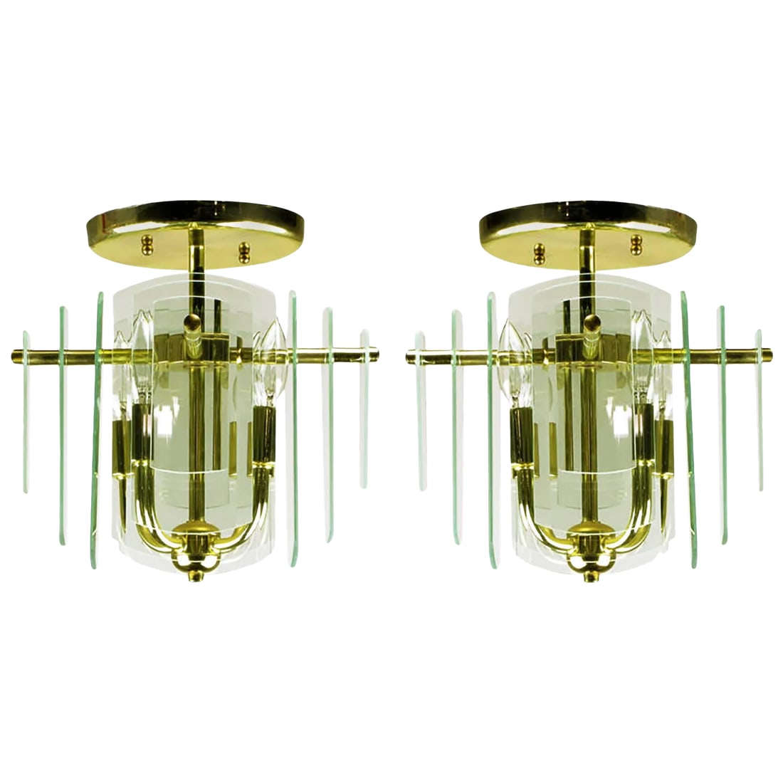 Brass and Beveled Graduated Glass Ceiling Lights - a Pair: A pair of brass four-arm ceiling lights with four sides of graduated and beveled glass. Each side features three layers of glass plates that step down in size from the center. One of three pairs