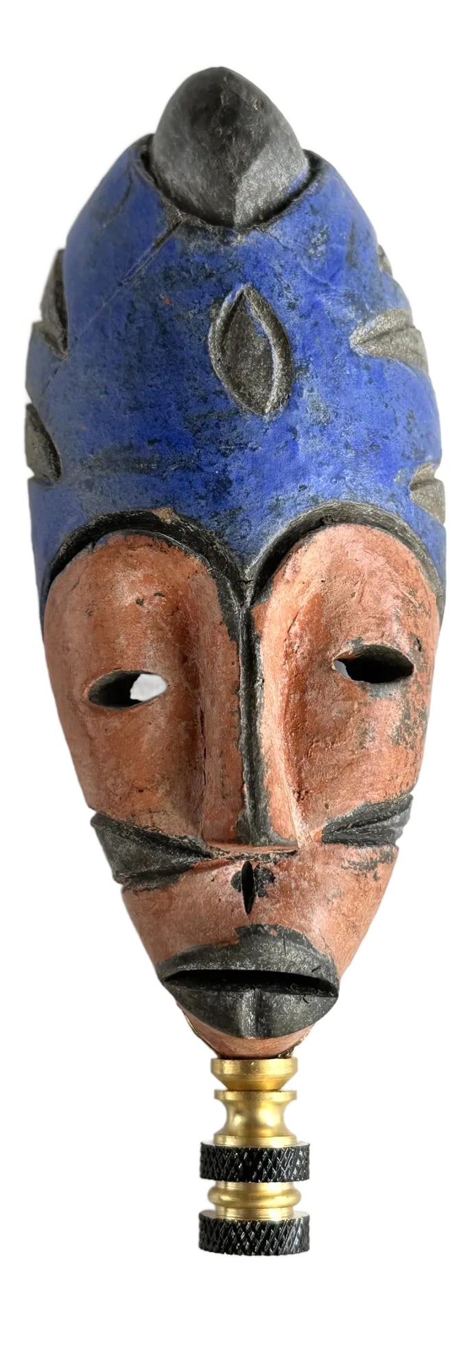 African Mask Lamp Finial: This towering one-of-a-kind lamp finial is crafted from a vintage pottery mask that is mounted on brass hardware sized to fit a standard-size lamp harp with a 1/4" stem. Condition: Imperfections: No I