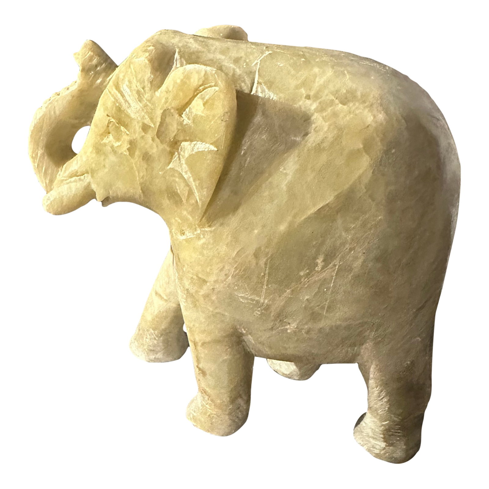 Late 20th Century Hand Carved Stone Elephant Figurine: Beautiful hand carved elephant sculpture, likely from India or Mexico in origin. Elephants often symbolize good luck, wisdom, strength, and prosperity in various cultures. The trunk is raised, which