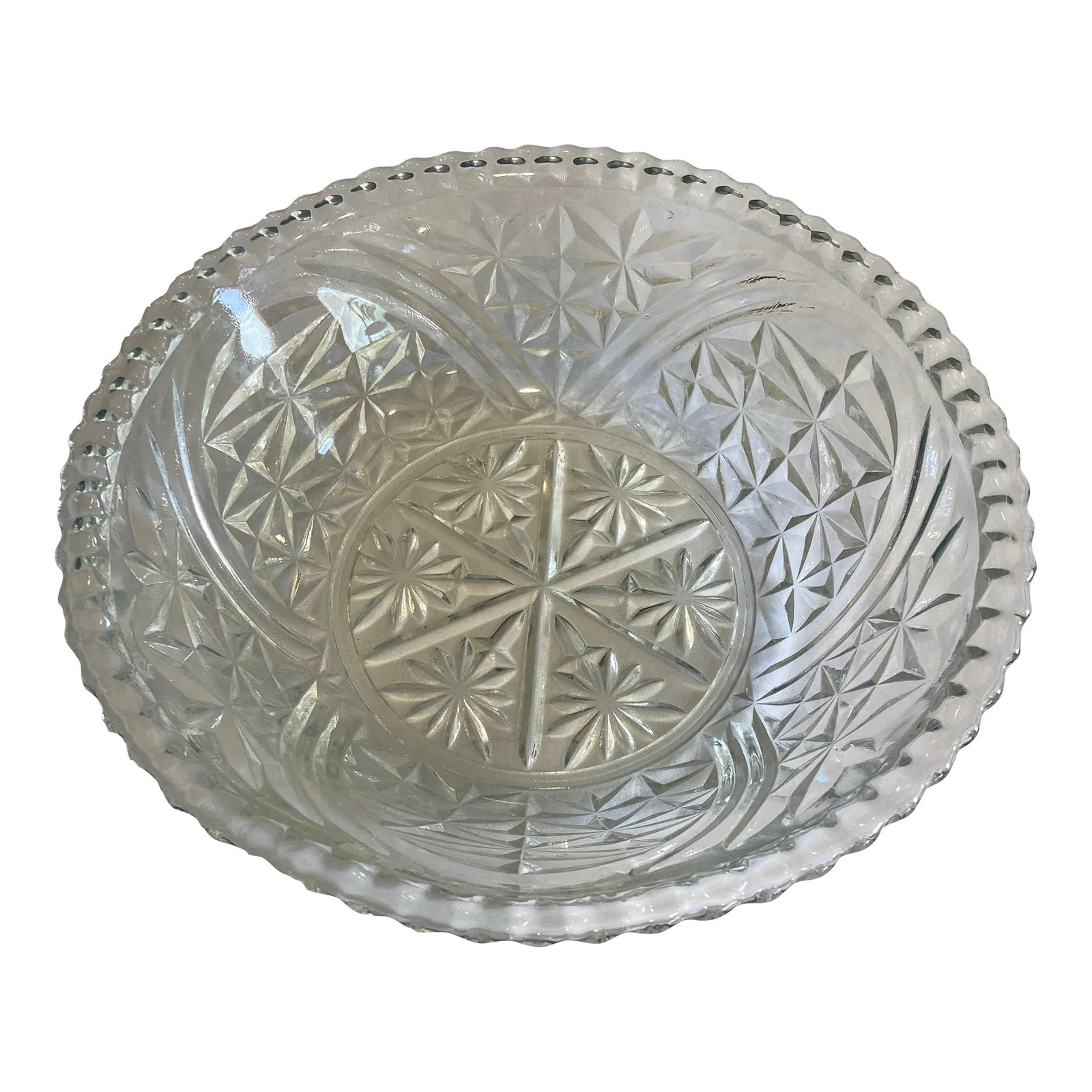 Vintage Cut Glass Serving Bowl: This beautiful serving bowl has cut glass flowers and stars. It also has a nice fluted edge. Condition: Alterations: Original Condition Unaltered Imperfections: Some Imperfections Condition Notes: