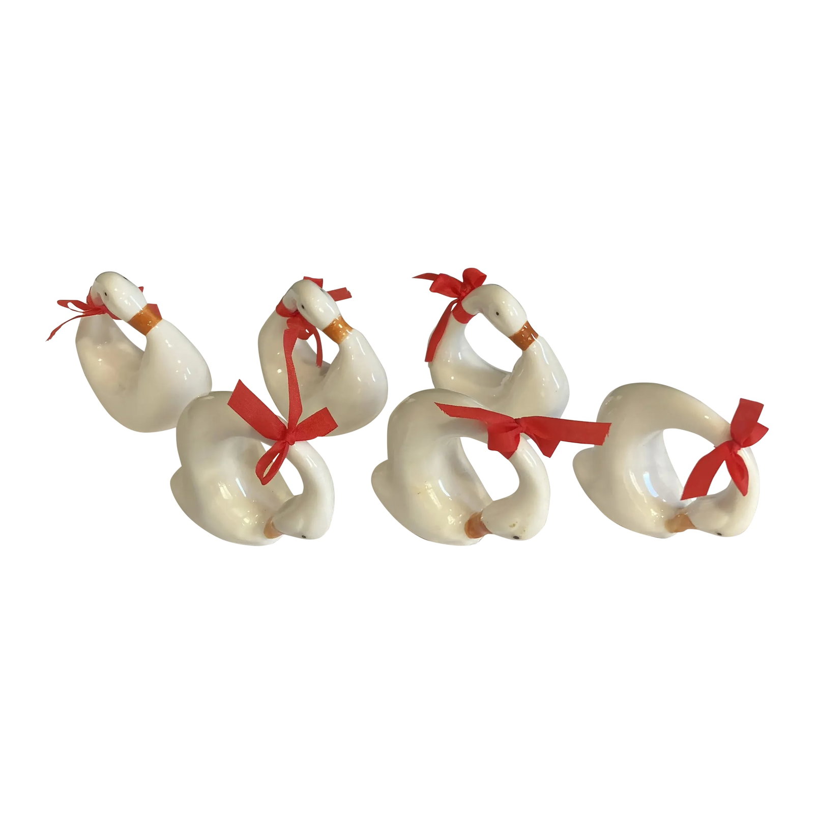 Vintage White Ceramic Swan Napkin Rings, Set of 6: A delightful set of six vintage ceramic napkin rings designed in the form of graceful swans. The sculptural curves and clean white finish give these pieces a timeless, decorative quality. Perfect for 