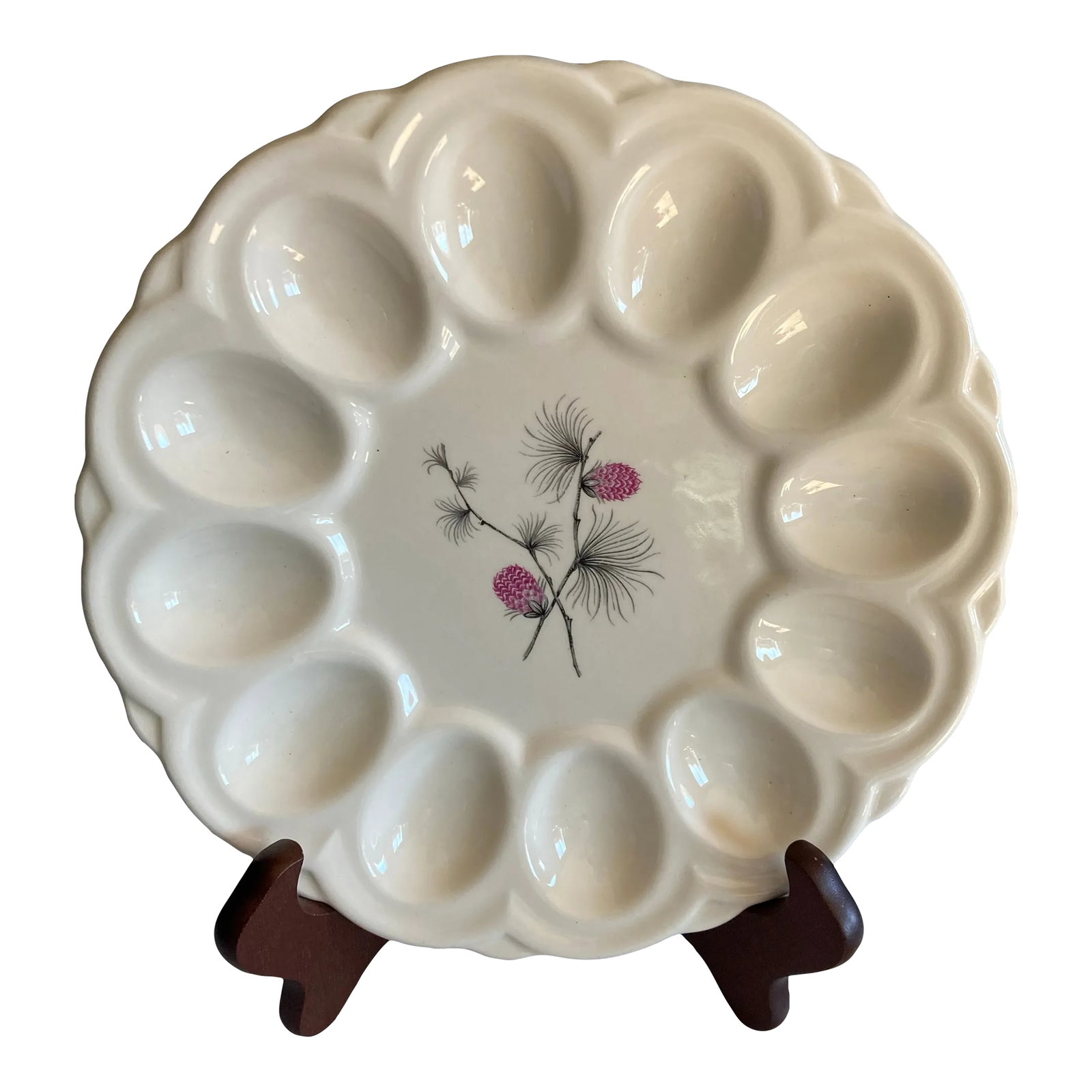 Vintage White Porcelain Egg Plate With Pink Berries: A beautifully preserved vintage deviled egg plate featuring a delicate pinecone and branch motif at the center. The scalloped edge design incorporates individual wells, making it ideal for serving