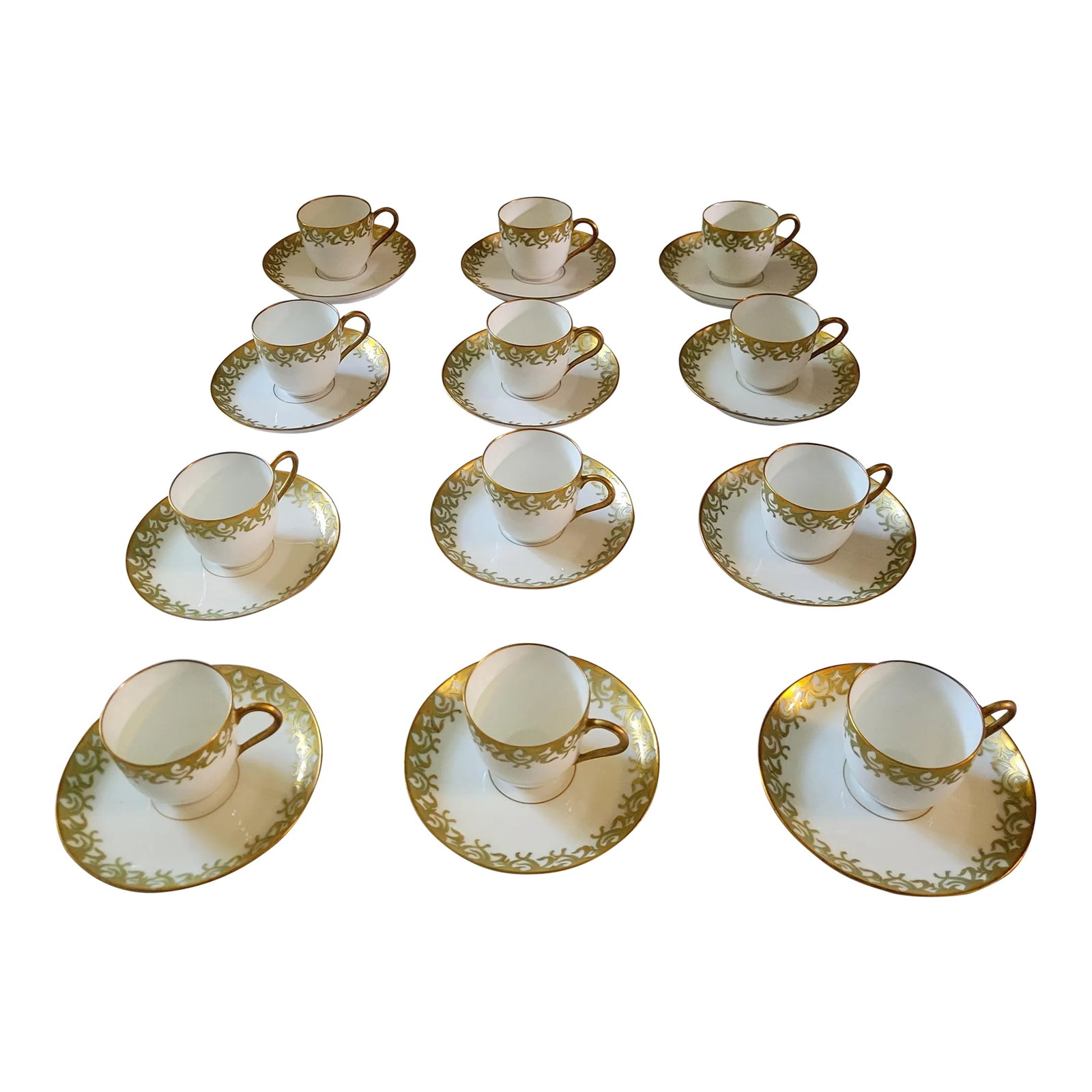 Antique GD&Cie Limoges for A. W. Grant Gilded Demitasse Cups Set- 24 Pieces: Lovely set of GD&Cie Limoges demitasse cups and saucers. Made for a High End shop, A.W. Grant, in Saginaw Michigan. Based on the markings and when the A.W. Grant was in business, this set is dated