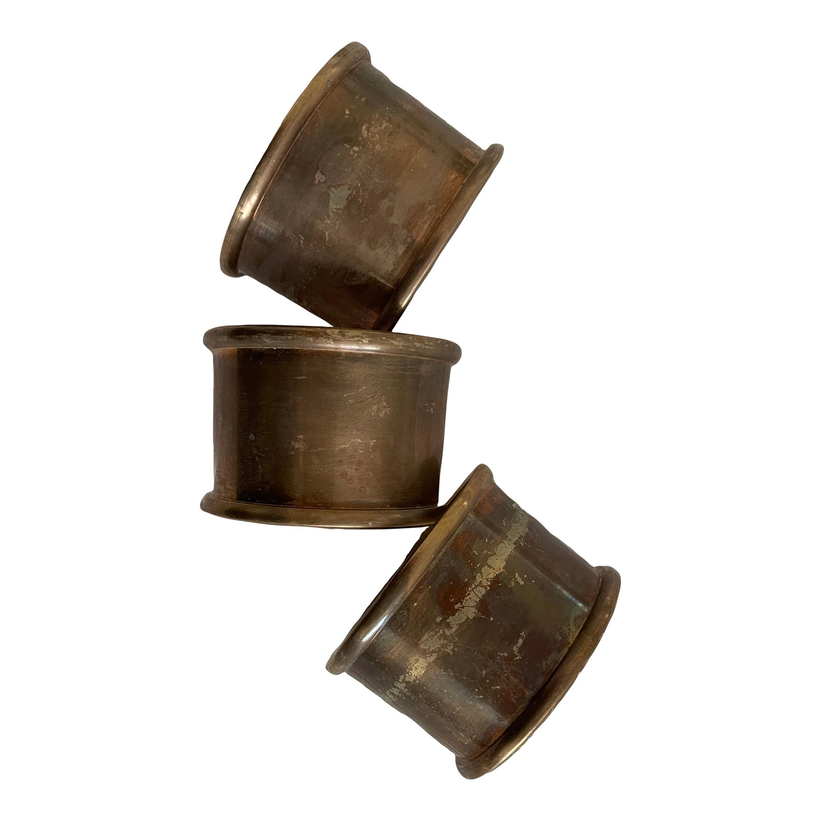 Set of 3 Vintage Brass Napkin Rings: The design of this set of three vintage napkin rings features a flat brass center bordered by flared edges on both sides, top and bottom, giving the napkin rings a classic wide band silhouette and a m