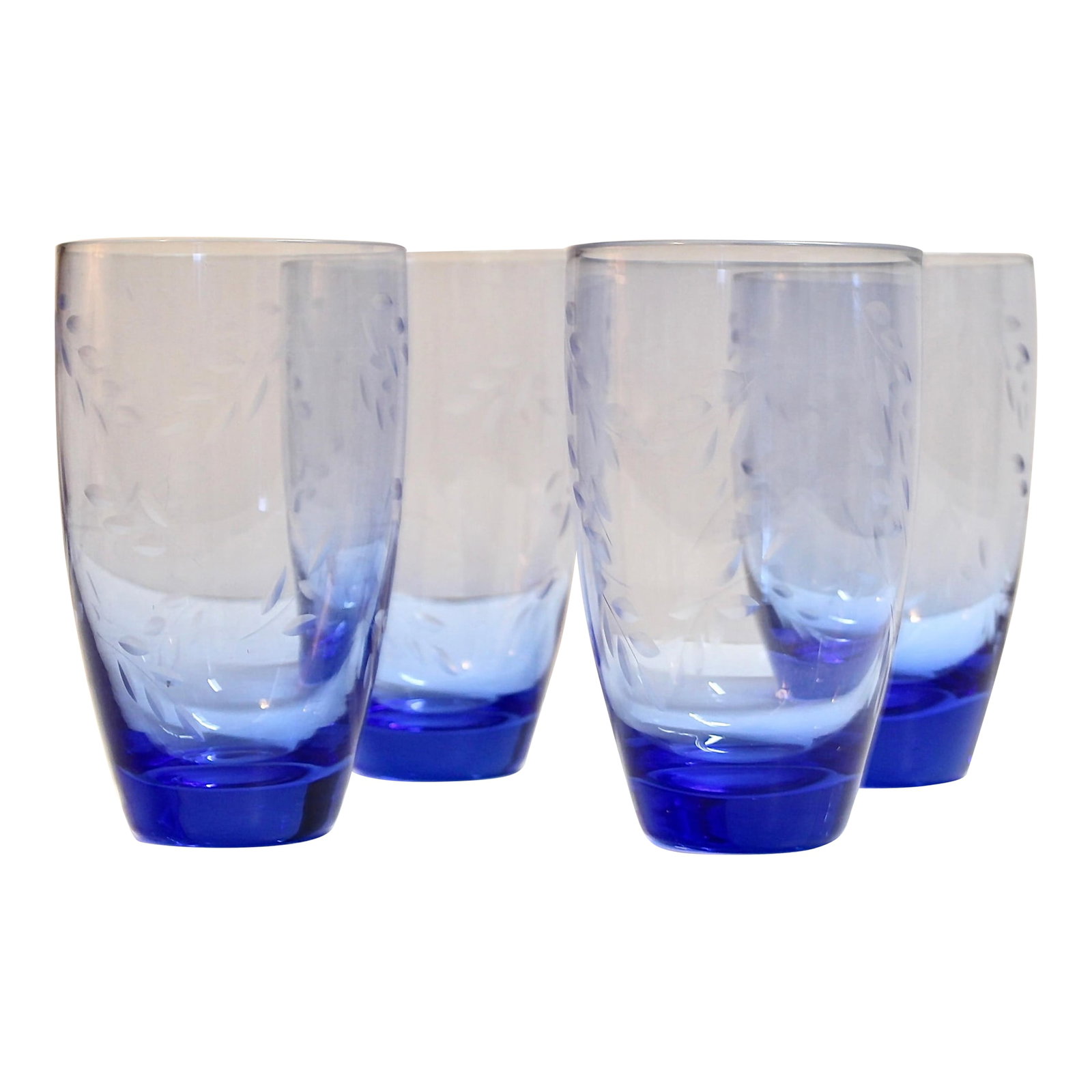 Pfaltzgraff Etched Blue Glass Drinkware 24oz | Set of 4: Elegant drinkware, each with an etched branch and leaf design. "Summer Breeze" by Pfaltzgraff Height: 6 1/2 in Width: 3 7/8 in 24 oz Condition: Alterations: Original Condition Unaltered