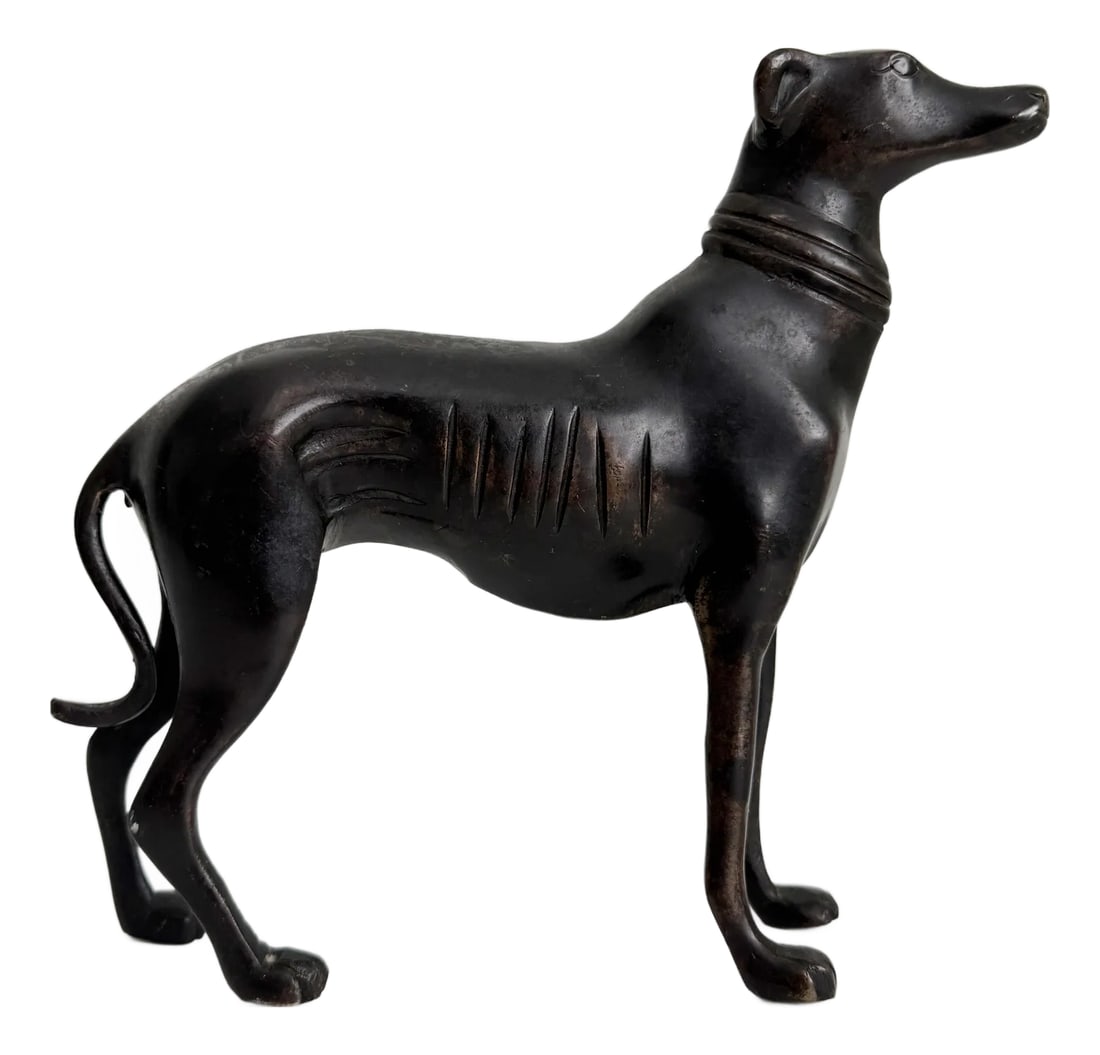 Art Deco Style Cast Bronze Greyhound Whippet Statue: Produced in the Mid-20th century in the Art Deco style, we present this handsome greyhound or whippet dog figurine statue in cast bronze. Nice quality, heavy, and finished in a deep bronze tone with