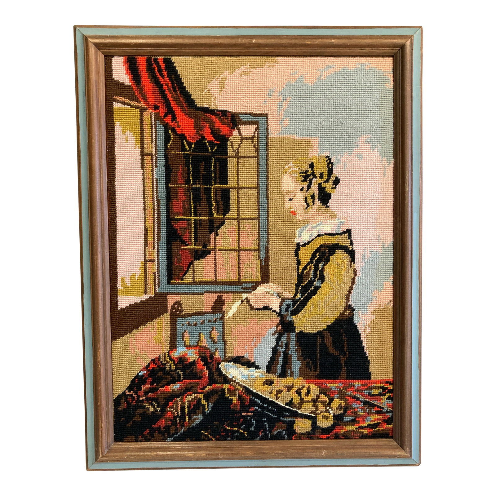 Vintage Framed Needlepoint Artwork After Vermeer Girl Reading at Window: A vintage framed needlepoint artwork inspired by Johannes Vermeer's "Girl Reading a Letter at an Open Window." The intricate stitching recreates the composition with rich texture and color, offering