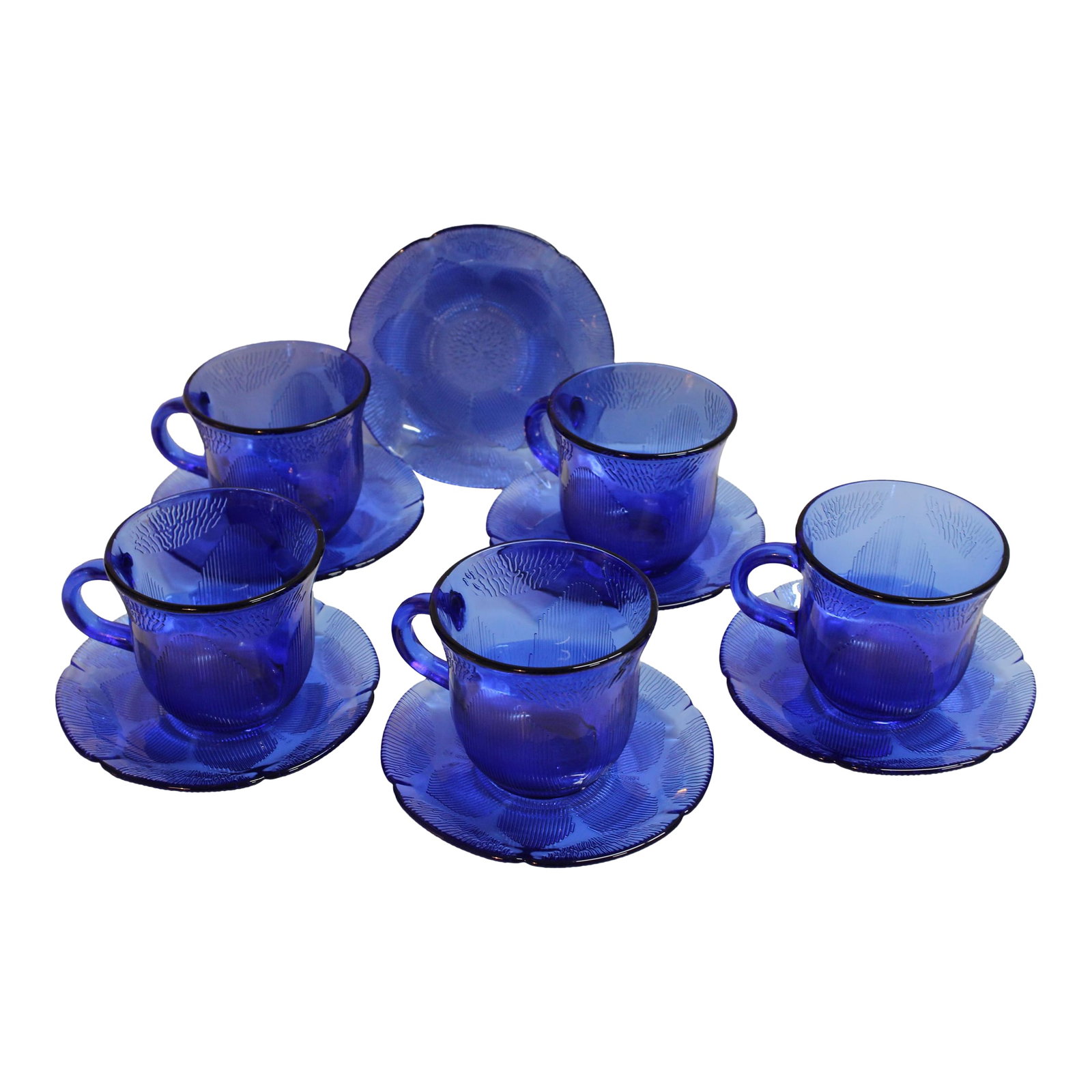 Forte Crisa Blue Glass Sunflower Cups and Saucers- 11 Pieces: Vintage Blue Sunflower Forte Crisa Mexico cobalt blue glass cups with saucers. 11-pieces include 6 saucers, 5 cups. Place setting pieces of this set available in separate listings. Condition: Very Goo