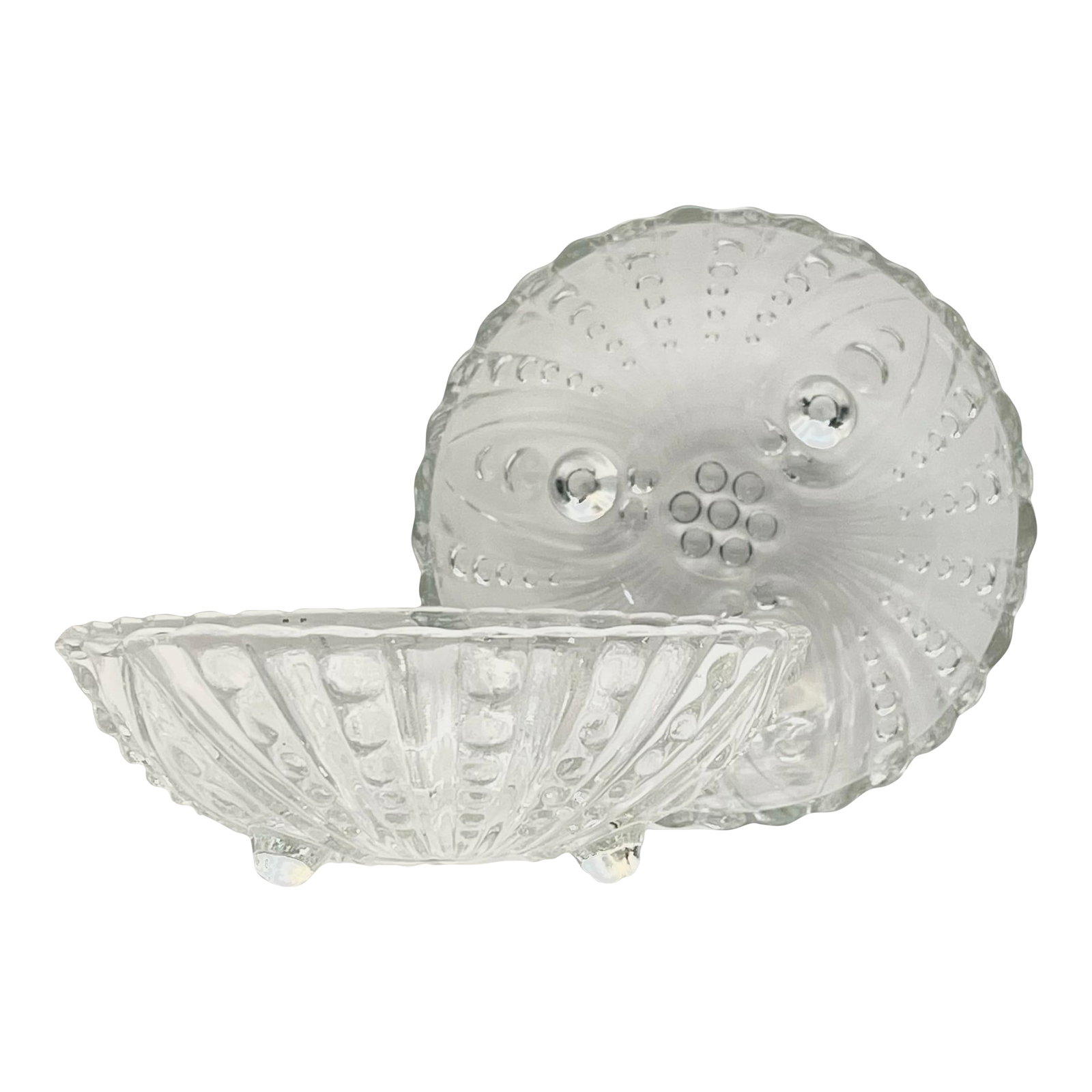 1950s Anchor Hocking "Inspiration" Small Bowls - A Pair: A pair of pressed glass bowls in a raised dot pattern fanning out from a central grouping of circles with three feet cleverly integrated into the design. These are an ideal size for candies, cards,