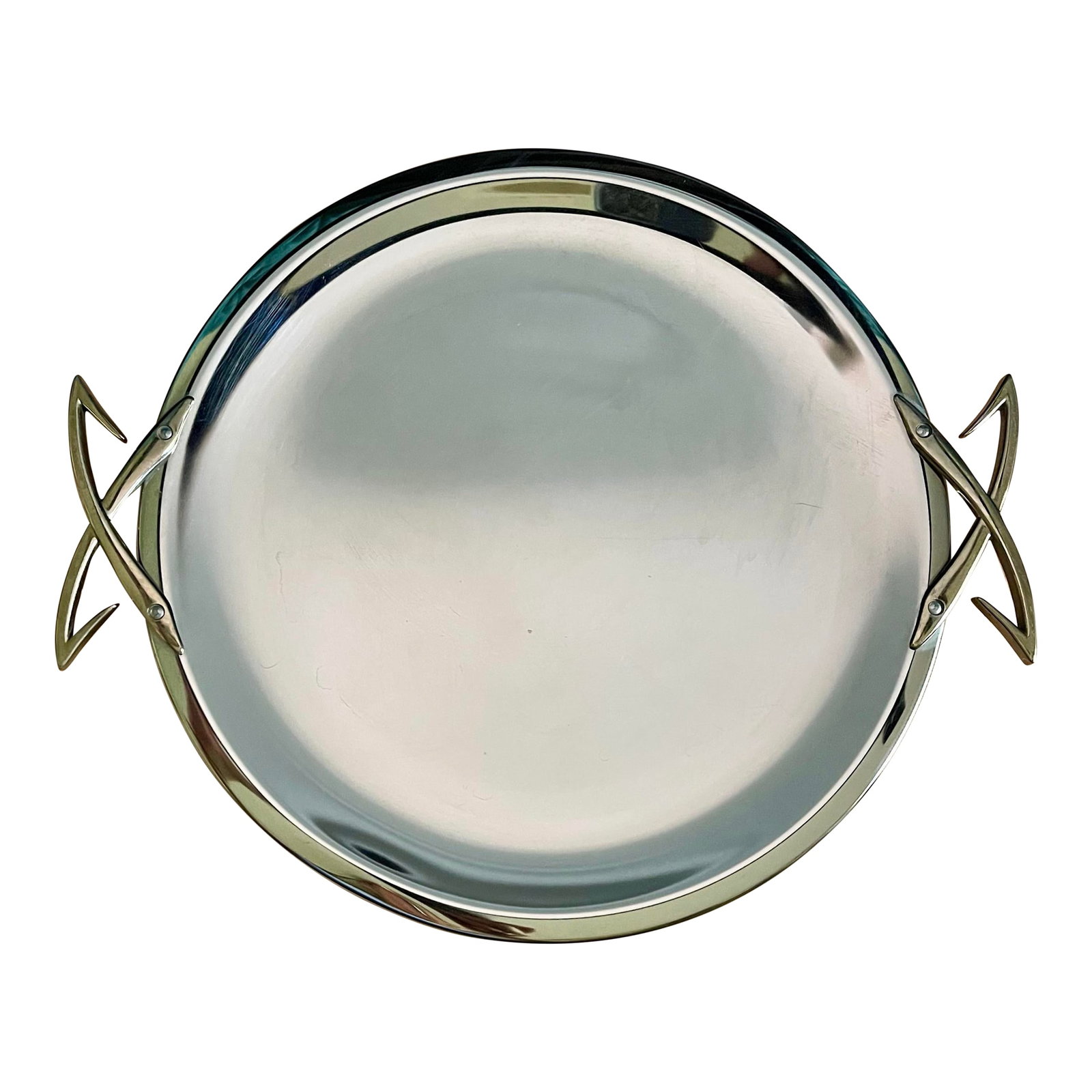 Mid 20th Century Kromex Chrome Serving Tray: A classic mid 20th century round chrome tray with abstract butterfly handles. Ships within 1-2 days using USPS. Arrives within 2-5 business days after receiving tracking. Condition: Alterations: Origi