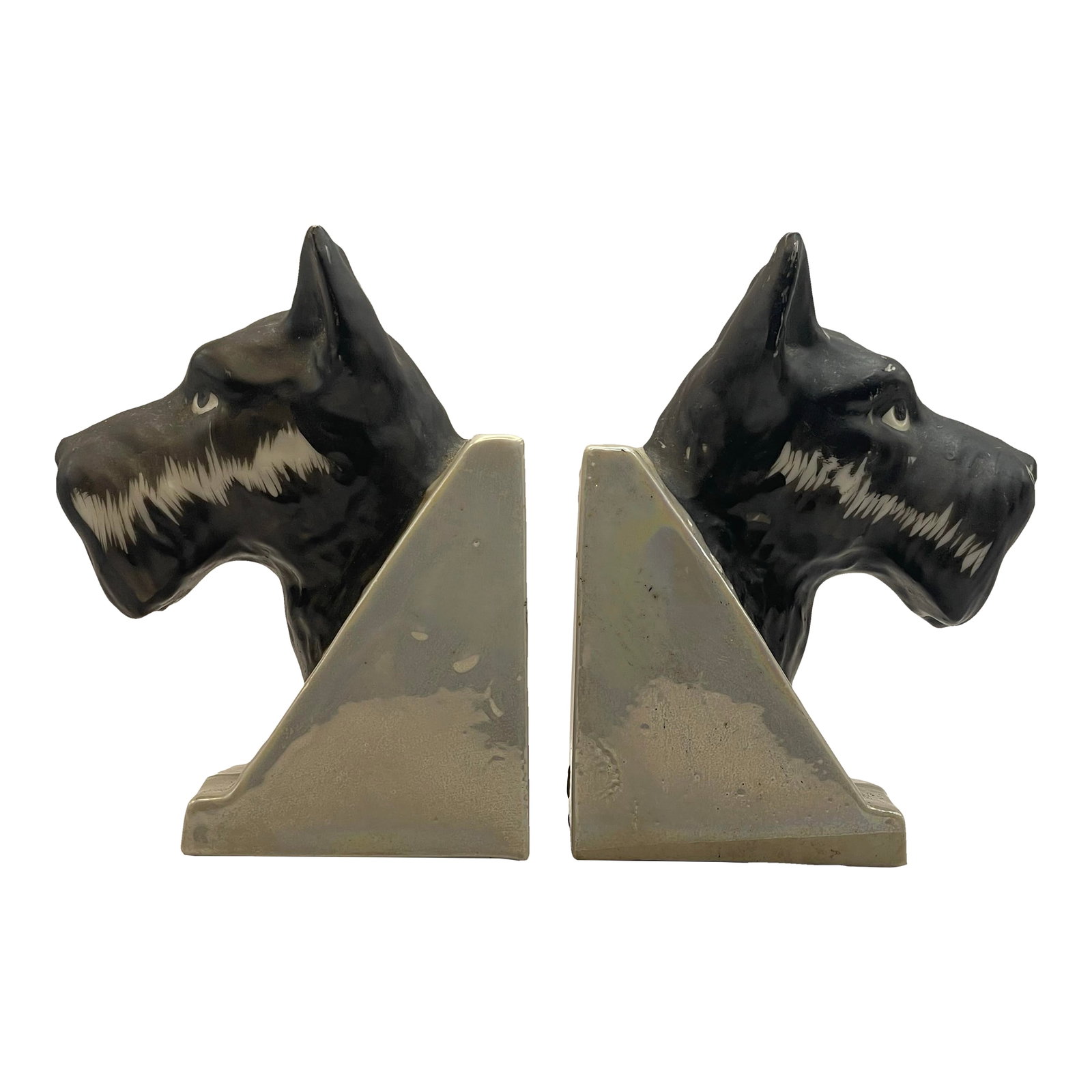 Vintage Scottish Terrier Bookends- A Pair: A charming pair of Scotty dogs on a lightly iridescent white background. Ships within 1-2 days using USPS. Arrives within 2-5 business days after receiving tracking. Condition: Alterations: Original