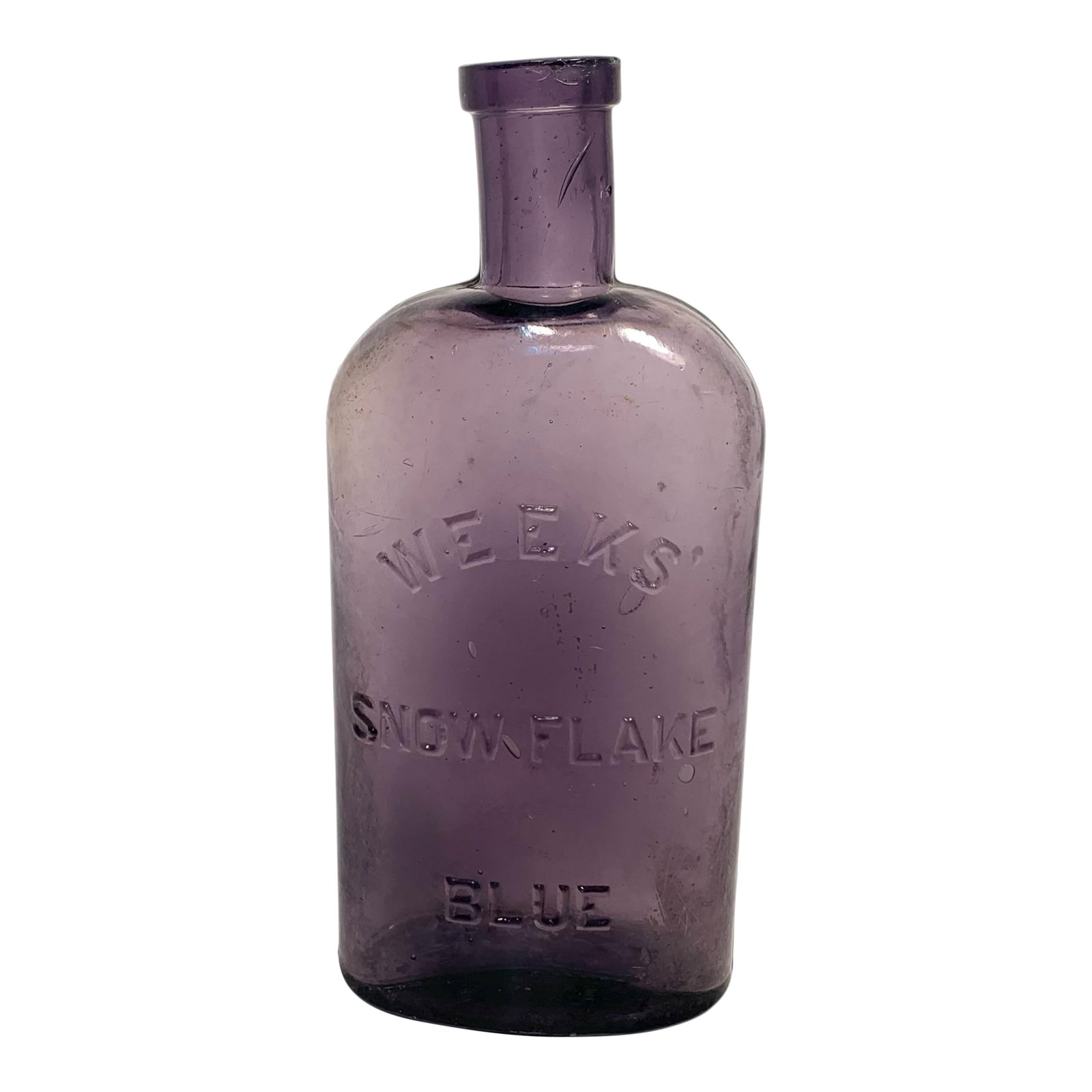Late 19th Century Weeks Amethyst Glass Laundry Bottle Victorian: This Weeks' Snow Flake Blue bottle dates to the late 19th century and originally held laundry bluing, a household whitening agent used to brighten linens and clothing. The glass contains manganese,