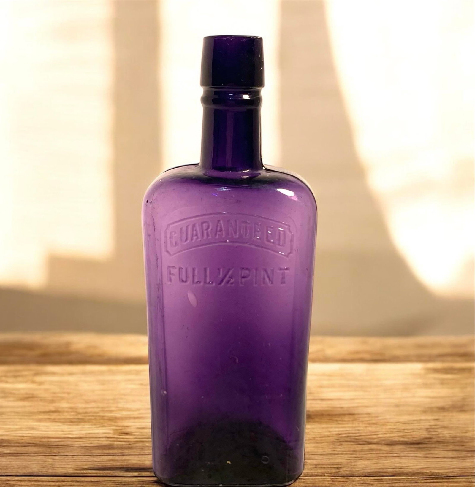 Early 20th C. Amethyst Embossed Half-Pint Whiskey Bottle - 2