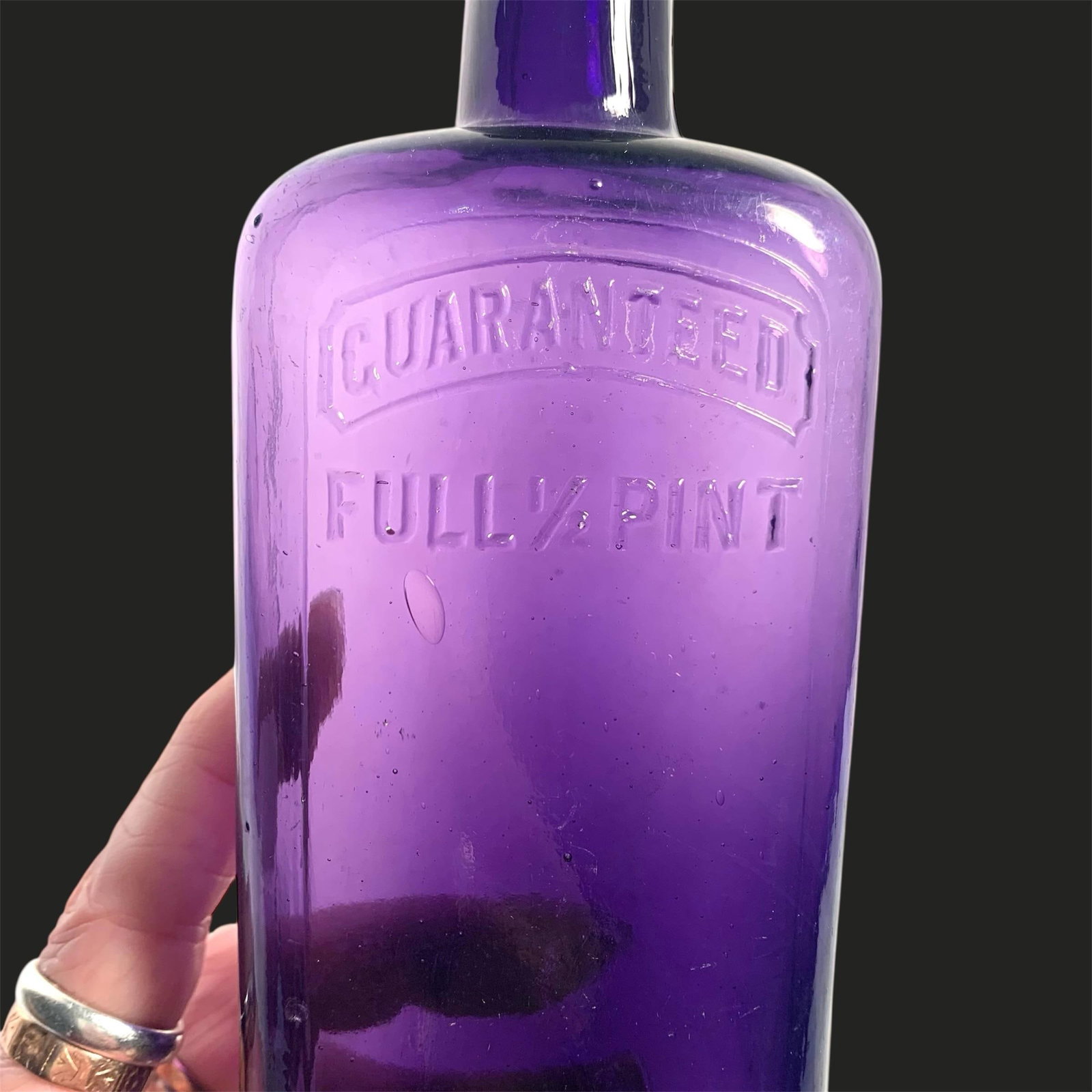 Early 20th C. Amethyst Embossed Half-Pint Whiskey Bottle - 3