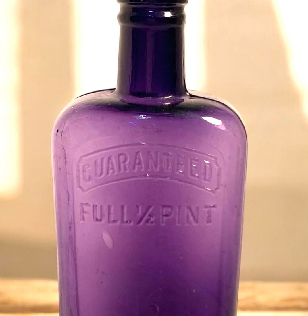 Early 20th C. Amethyst Embossed Half-Pint Whiskey Bottle - 6