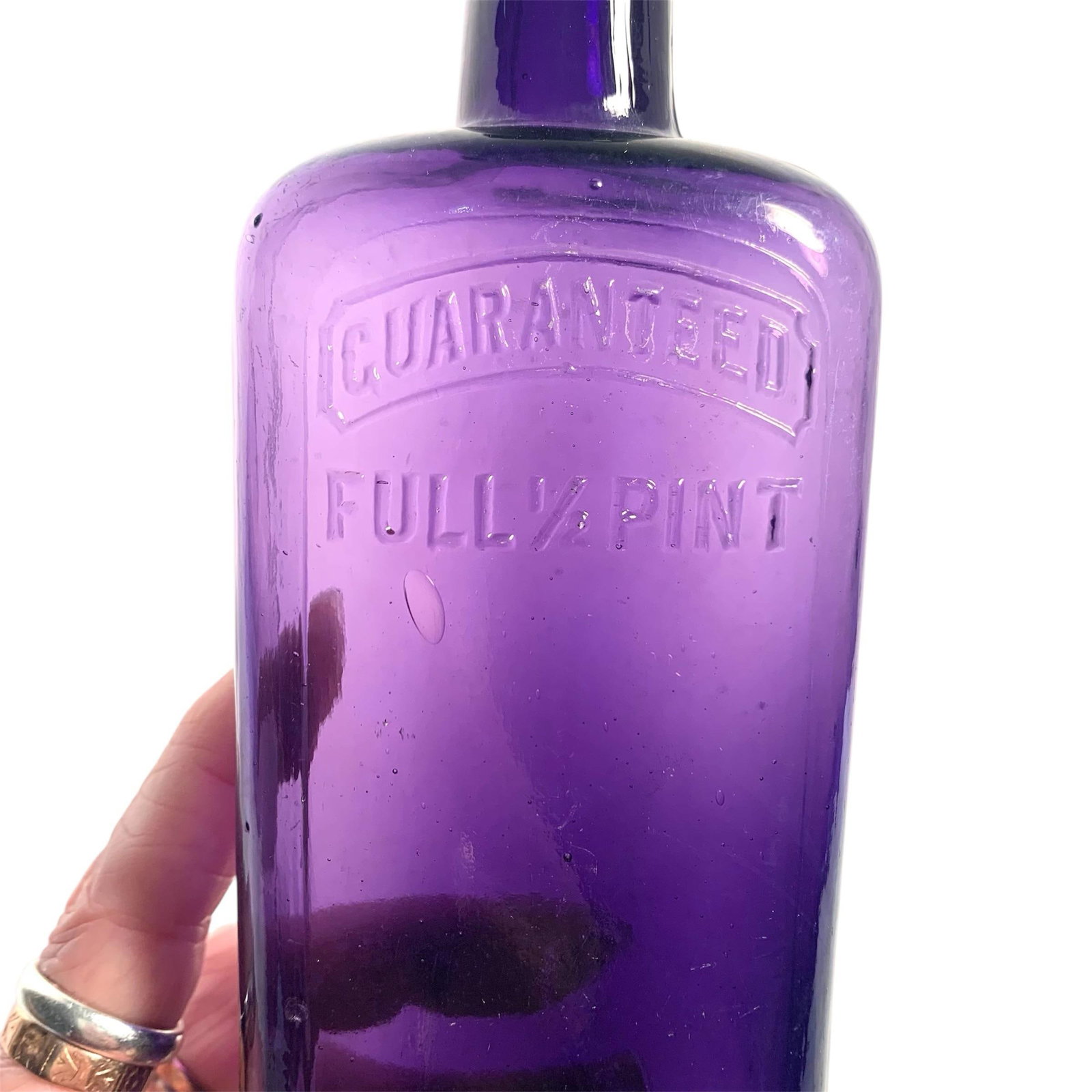 Early 20th C. Amethyst Embossed Half-Pint Whiskey Bottle - 7