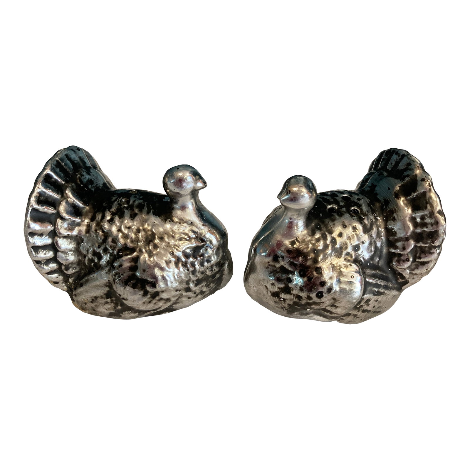 Vintage Ceramic Turkey Salt & Pepper Shakers With Metallic Silver Finish: A charming pair among our curated vintage finds, these turkey salt and pepper shakers showcase the delightful novelty tableware popular in mid-century American home decor. Crafted from ceramic with an