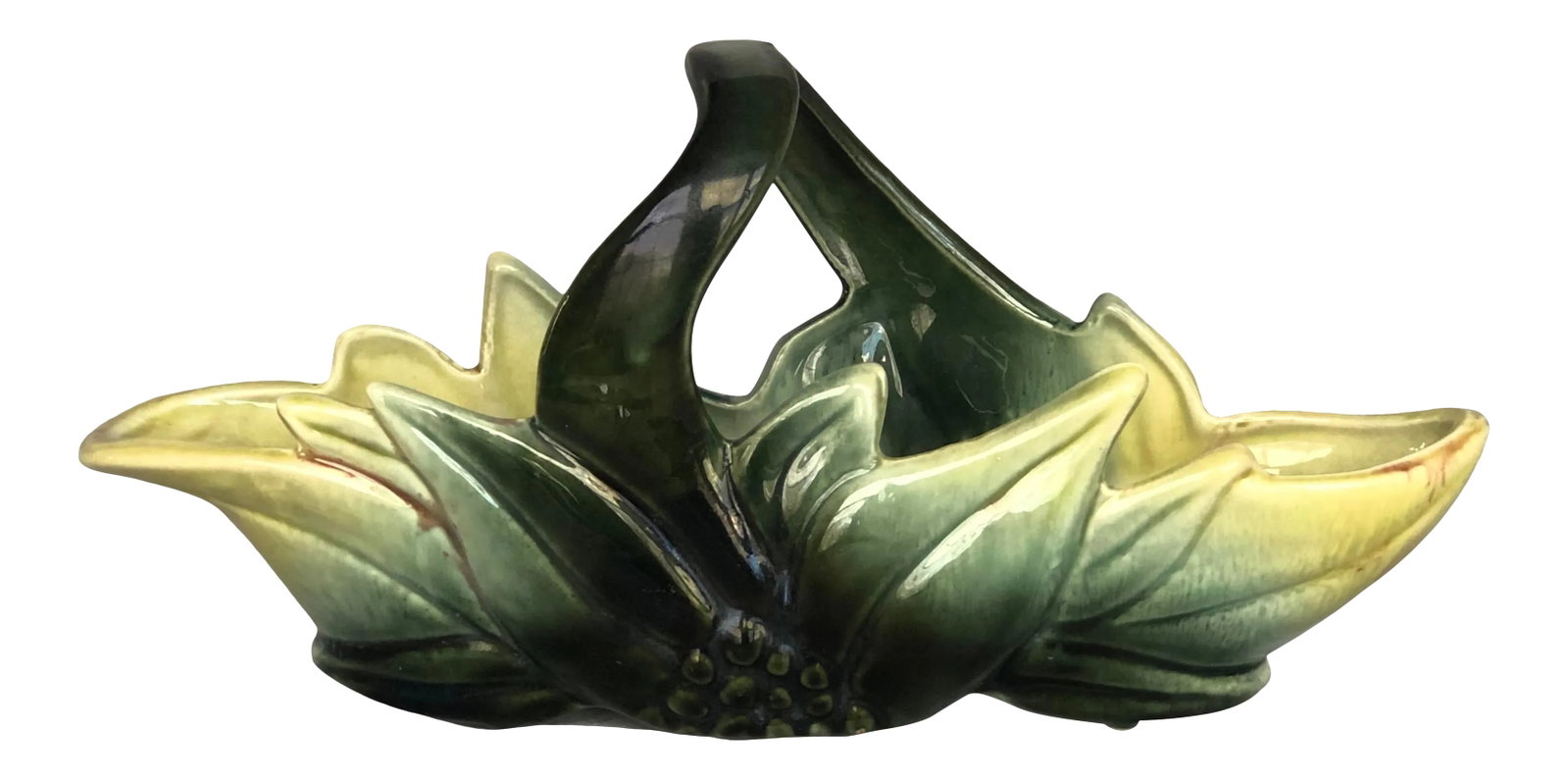 1950s Hull Pottery Basket Indoor Planter: Display this vintage Hull pottery planter with an array of small house plants or use it as a decorative catch-all on your office desk or hallway table. Unmarked, the vintage ceramic indoor planter is 