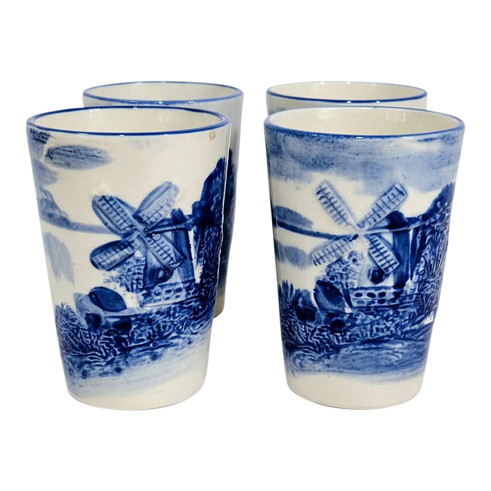 Vintage Delft-Style Blue & White Windmill Tumblers - Set of 4: Vintage Delft-style blue and white windmill tumblers in a charming set of four, marked Made in Japan, featuring classic Dutch landscape scenes wrapped around each cup with rich cobalt detailing.