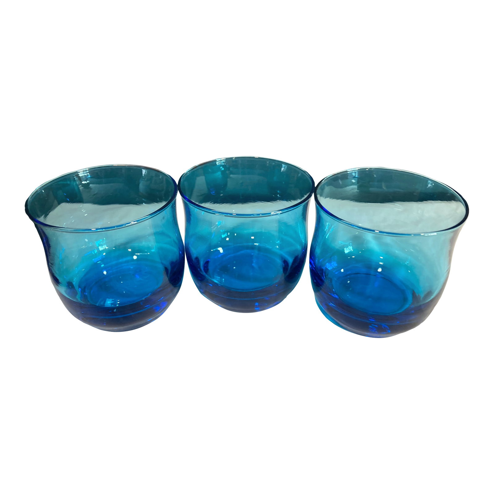 Mid 20th Century Midcentury Turquoise Blue Juice Glasses,, Set of 3: This striking set of three turquoise blue juice glasses brings vibrant Mid-Century Modern charm to any bar or kitchen. The subtly curved shape and saturated color make them standout accent pieces