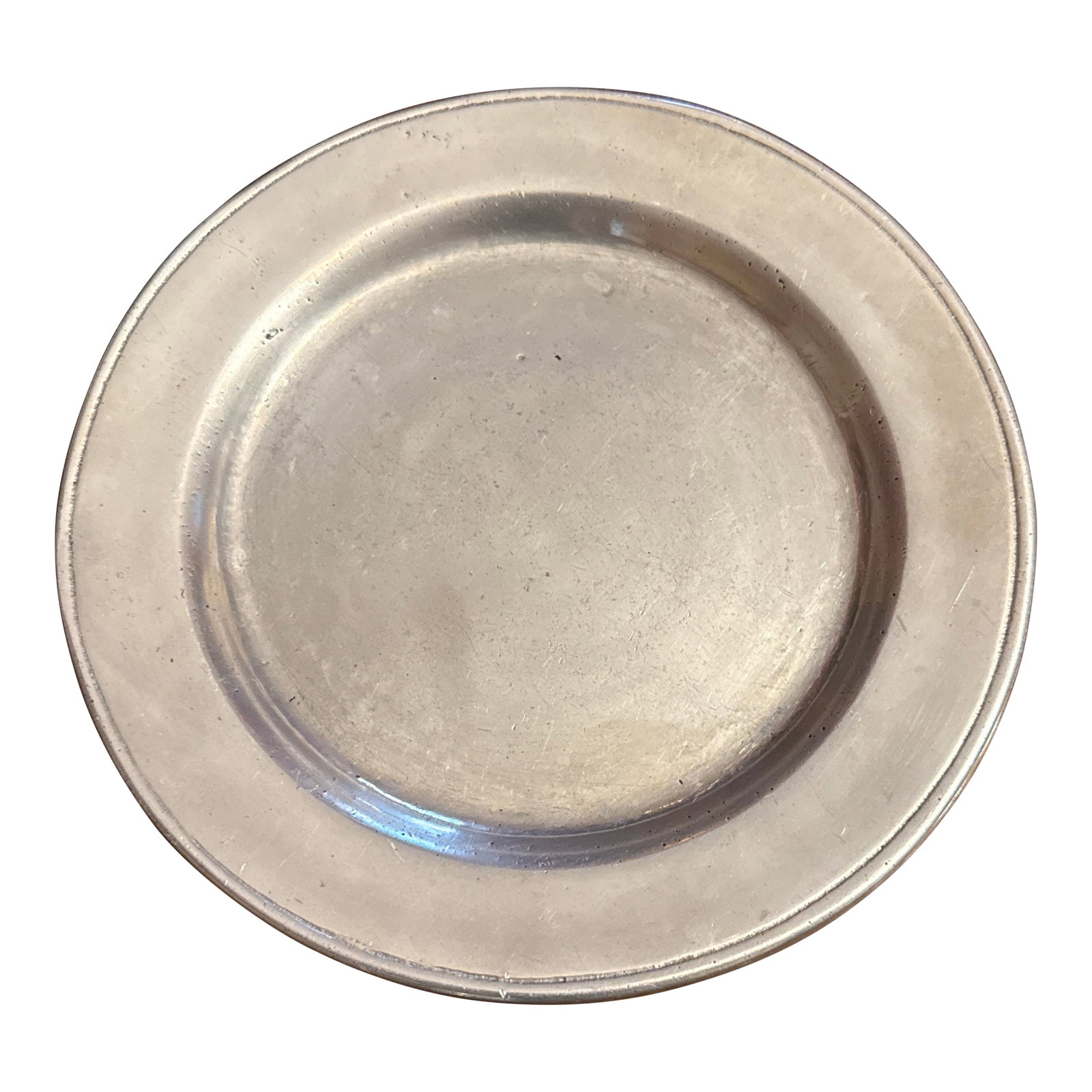 Small Round Pewter Plate: A lovely small Wilton Armetale, Pennsylvania pewter plate. Good as a catchall tray or to hold a pillar candle. Condition: Alterations: Original Condition Unaltered Imperfections: Some Imperfections