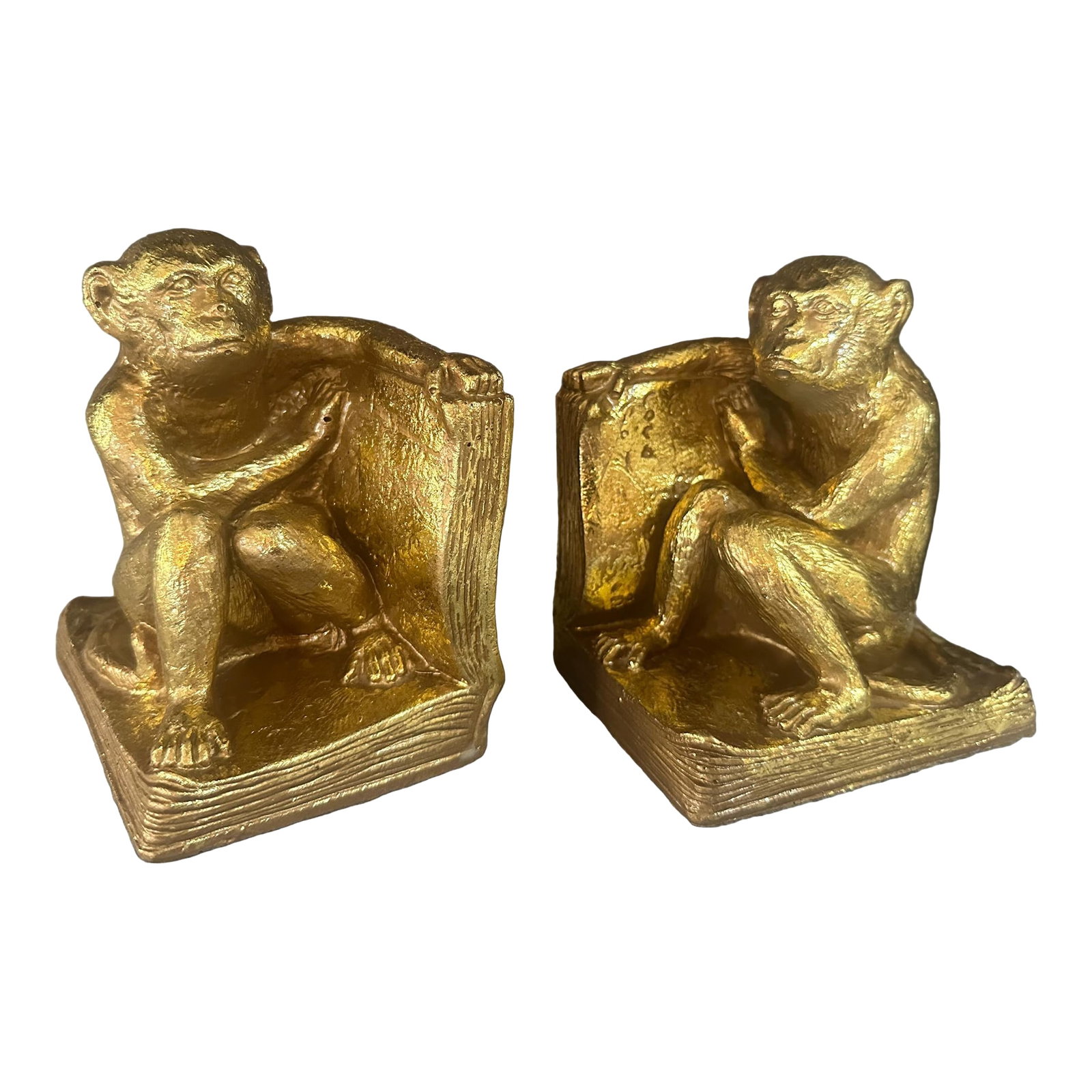 Vintage Gold Gilt Monkey Bookends | Pair: 1965 vintage bookends by SPI San Pacific California, made in Taiwan (ROC). Heavy resin with thick, gold gilt paint. Bright gold gilded monkey sitting on an open book with pensive look. Condition: