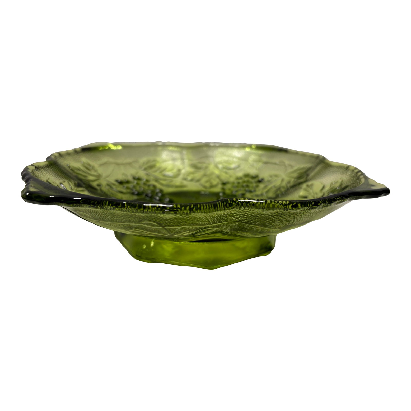 Vintage Indiana Glass Green Grape Pedestal Bowl, Mid-Century Pressed Glass: Vintage green pressed glass pedestal bowl featuring a raised grape and leaf motif. This mid-century piece by Indiana Glass showcases a beautiful olive-green hue, scalloped rim, and square pedestal bas