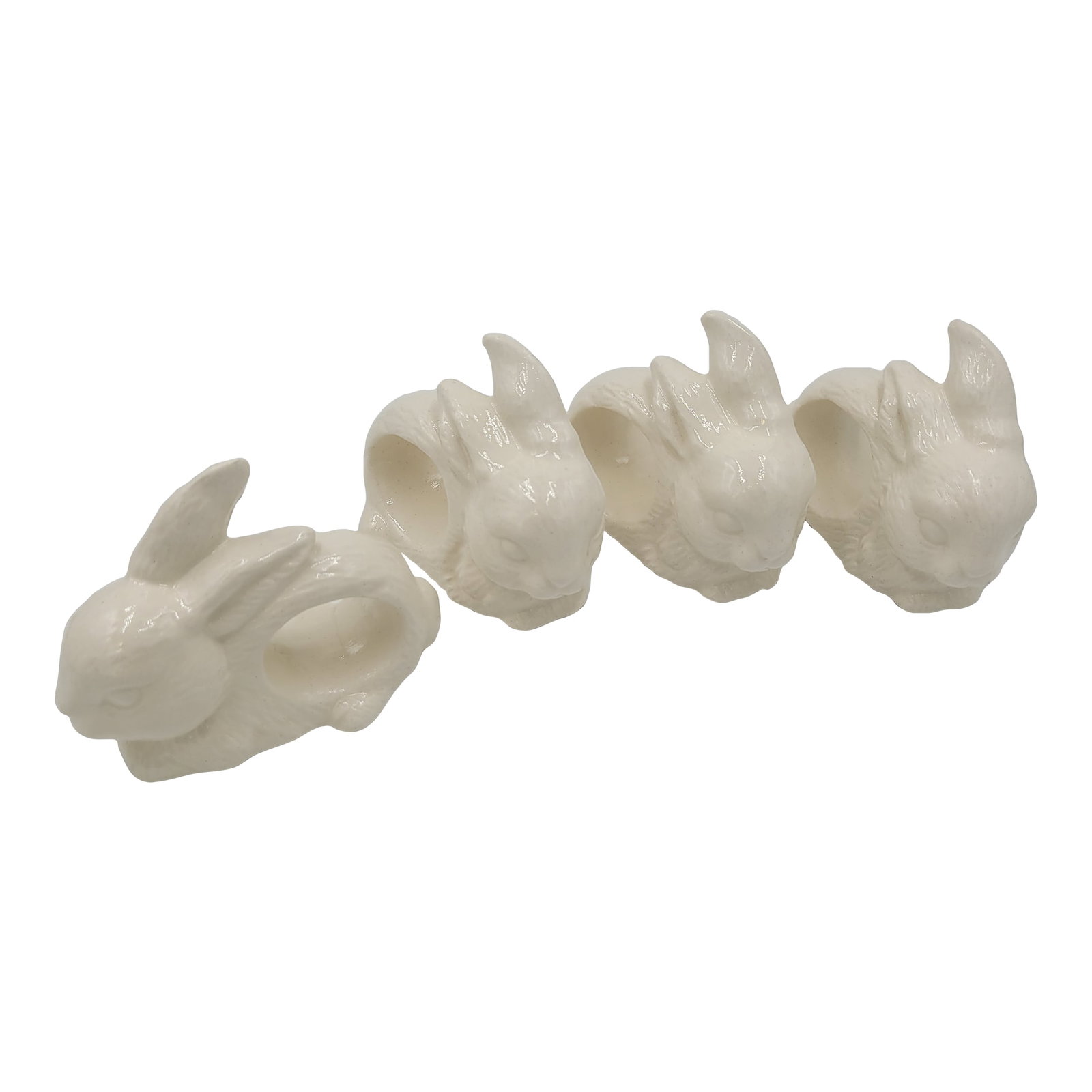 1990s Farmhouse Glazed White Ceramic Bunny Napkin Rings-Set of 4: Elevate your holiday table with this whimsical set of four white ceramic bunny napkin rings. Finished in a white glaze, these bunnies offer a soft, elegant glow that compliments both casual linens and