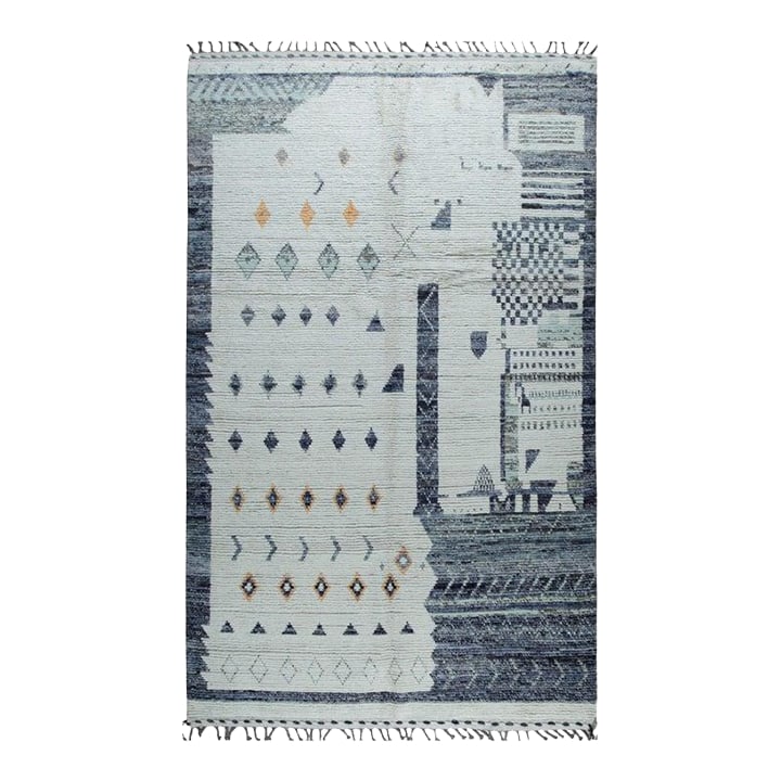 6x9 Gray Hand-Knotted Wool Diamond Field Tribal Modern Carpet Rug: This hand knotted pile rug features a primary gray color and is crafted from natural wool. Modeled after the traditional Berber carpet style, this piece originates from Pakistan. The construction resu
