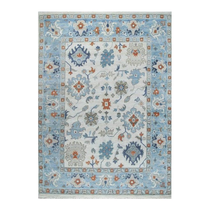 8x10 Ivory Hand-Knotted Wool Sky Blue Border Classic Traditional Carpet Rug: This hand knotted pile rug features a classic traditional design in a primary palette of ivory, beige, and cream white. Crafted from wool, this Agra style rug originates from India and presents a