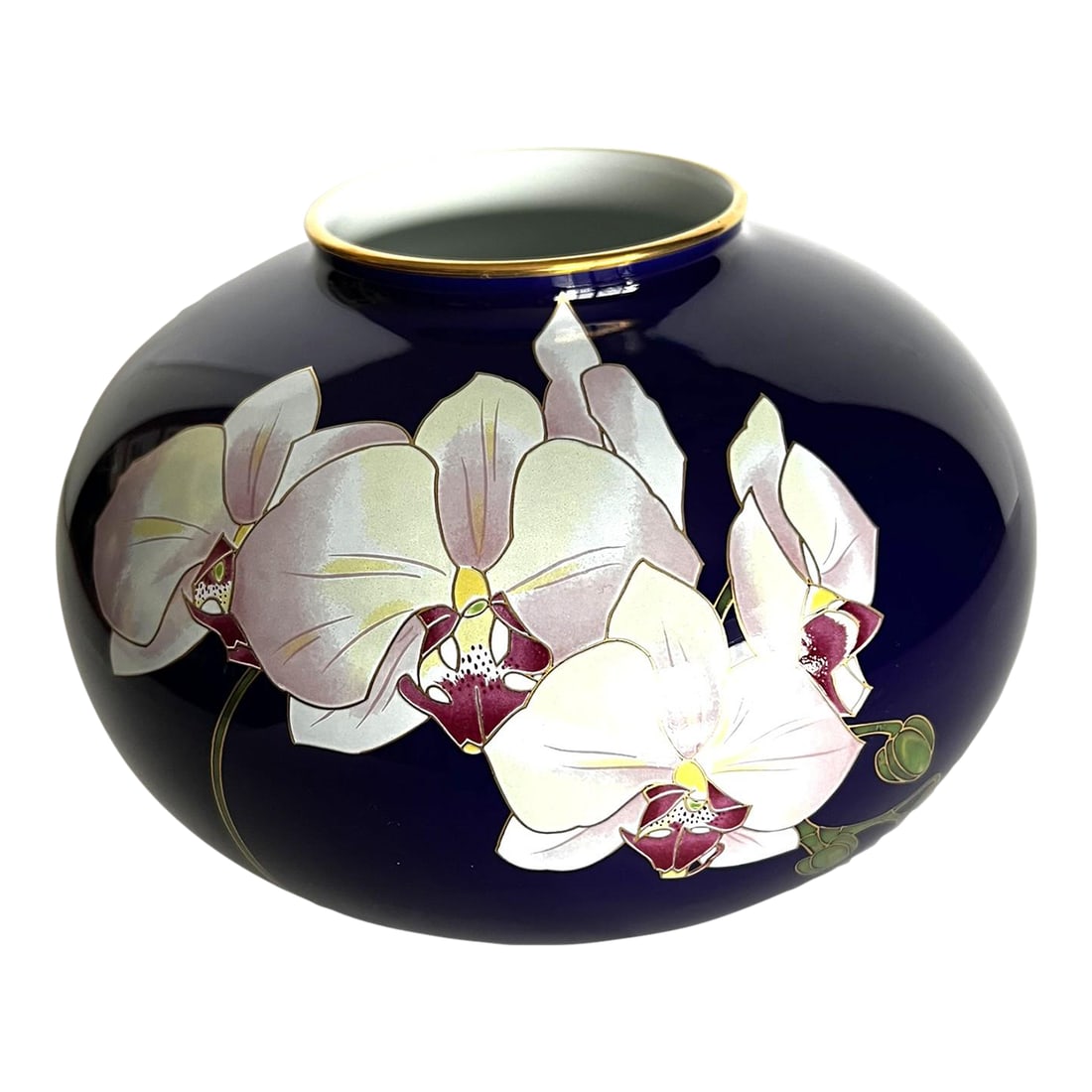 Koransha Porcelain Vase Featuring White Orchids on a Cobalt Blue Ground: The beautiful rich cobalt blue of this attractive round vase decorated with orchids from the Koransha company cannot be captured by my camera. In fact, the natural light is playing with me, giving me
