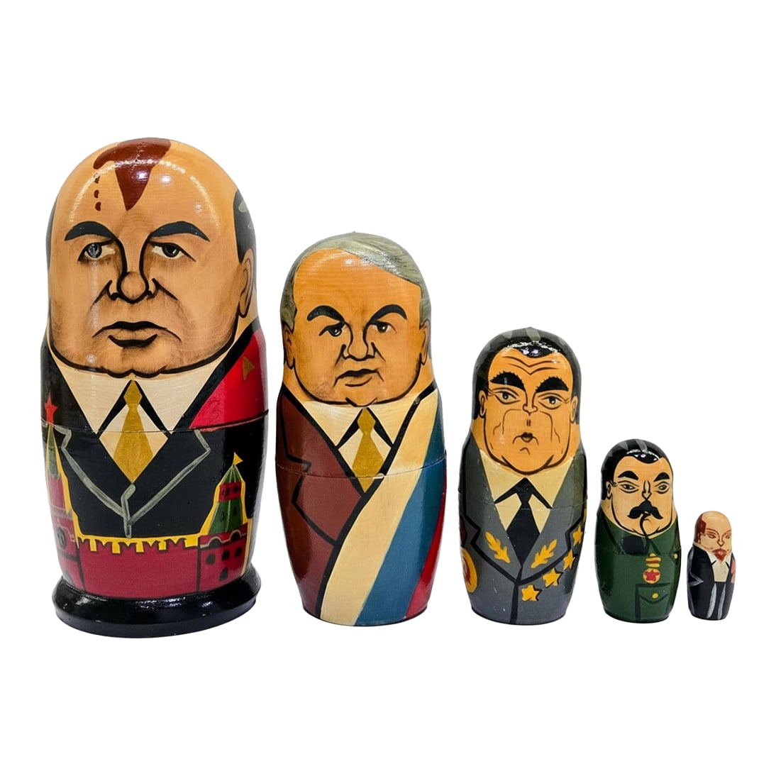 Vintage Russian Political Nesting Dolls, Hand-Painted Moscow 1991, Set of 5: Graphic vintage set of hand-painted Russian matryoshka nesting dolls featuring late-Soviet political figures, made in Moscow and dated 1991 in ink inside the largest doll. The five graduated wood