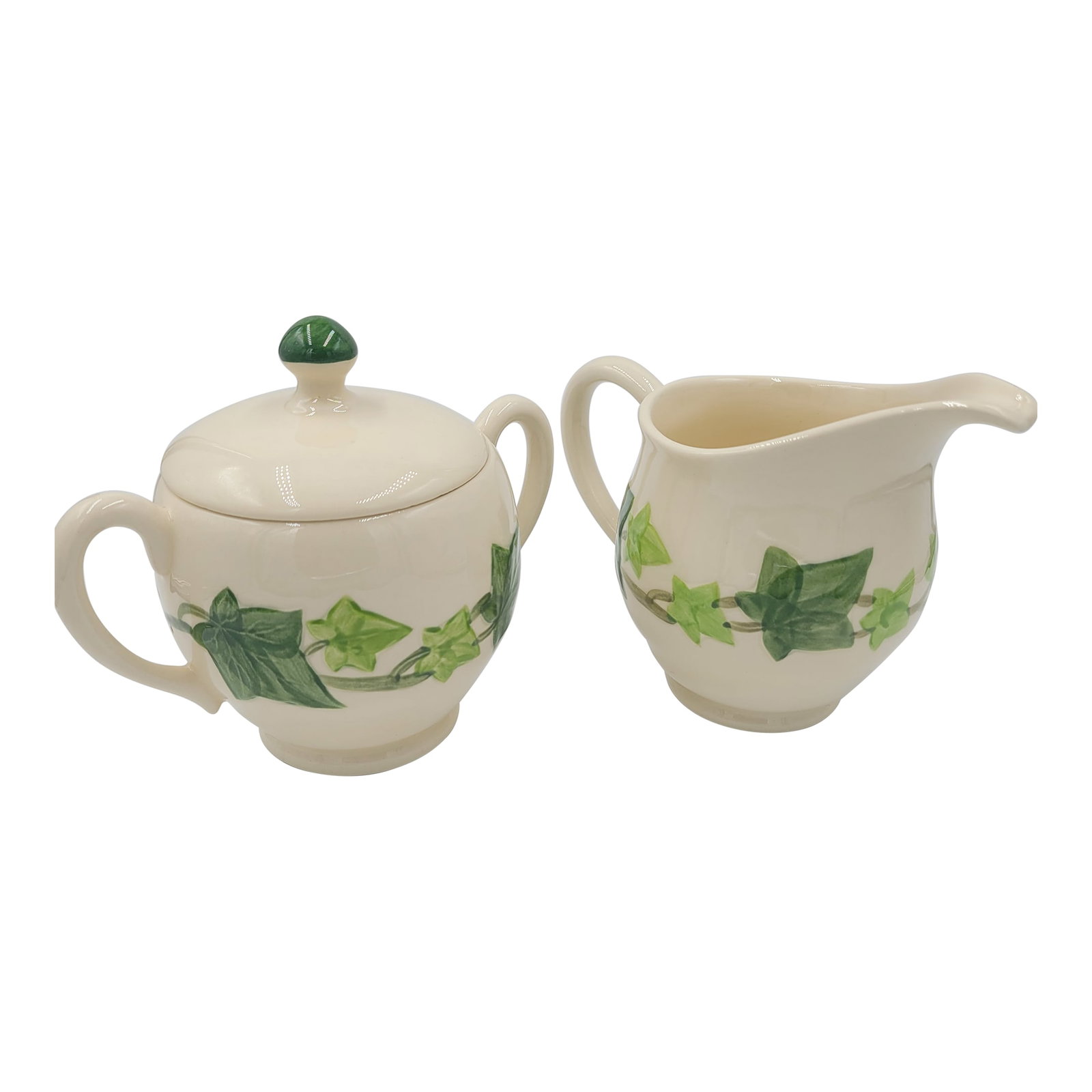 1950s Franciscan Ivy Hand-Decorated Creamer & Lidded Sugar Set - 3 Pieces: A charming vintage cream and sugar set in the iconic "Ivy" pattern by Franciscan. Hand-decorated by Gladding, McBean & Co. in California, this set features a creamy white earthenware body adorned