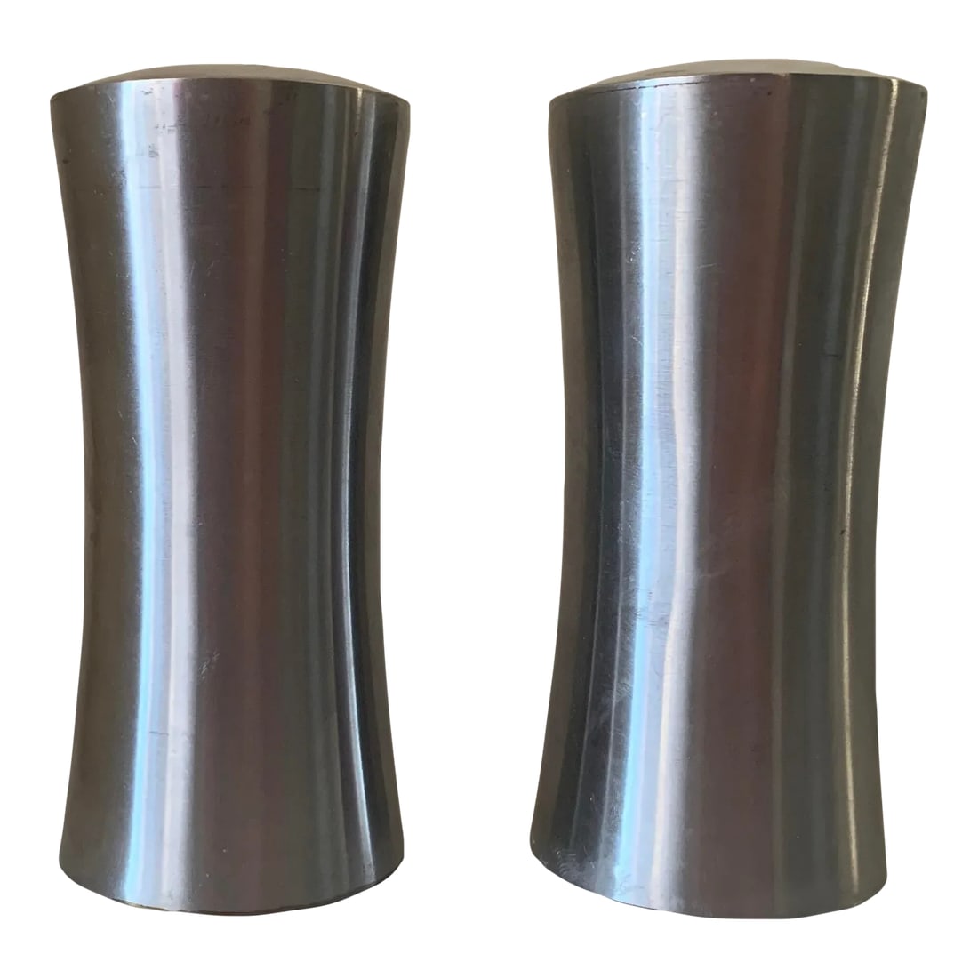Mid Century Modern Stainless Steel Salt and Pepper Shakers From Sweden- a Pair: This pair of 8-18 stainless steel tapered salt and pepper shakers is ideal for creating an authentic MCM dinner table. They are sleek and modern looking but yet manufactured by the Cultura company of 