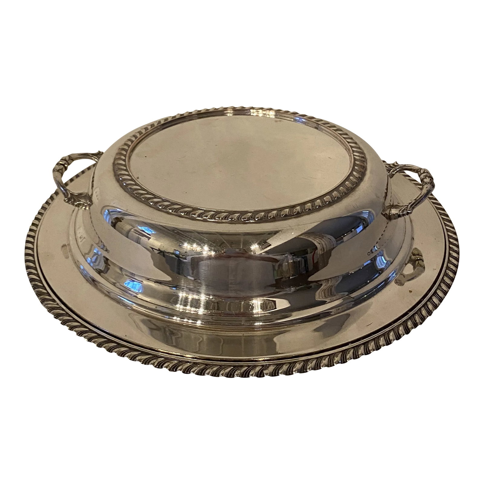 Vintage Large Silverplate Covered Entree Dish: Lovely vintage silverplate (silver over copper) covered round dish with gadrooned edge on both top and bottom and applied cast handles on top. If you are not familiar with these pieces, they were