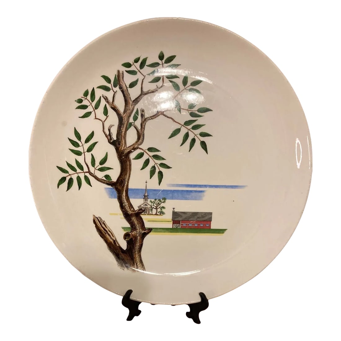 1949 Santa Anita Ware Hand-Painted Americana Plate With Barn & Church Scene: This hand-painted ceramic plate by Santa Anita Ware features a nostalgic barn and church scene in earthy Americana tones. Made in California in 1949, it's a classic example of Modern Americana