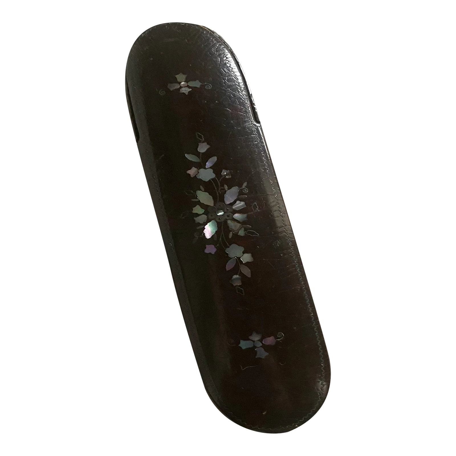 Victorian Papier-Mache Eyeglass Case: This is a Victorian papier-mache eyeglass case painted black and decorated with mother of pearl. The case is lined with red leather. Good condition and the top flips open. Dimensions are 6" long by