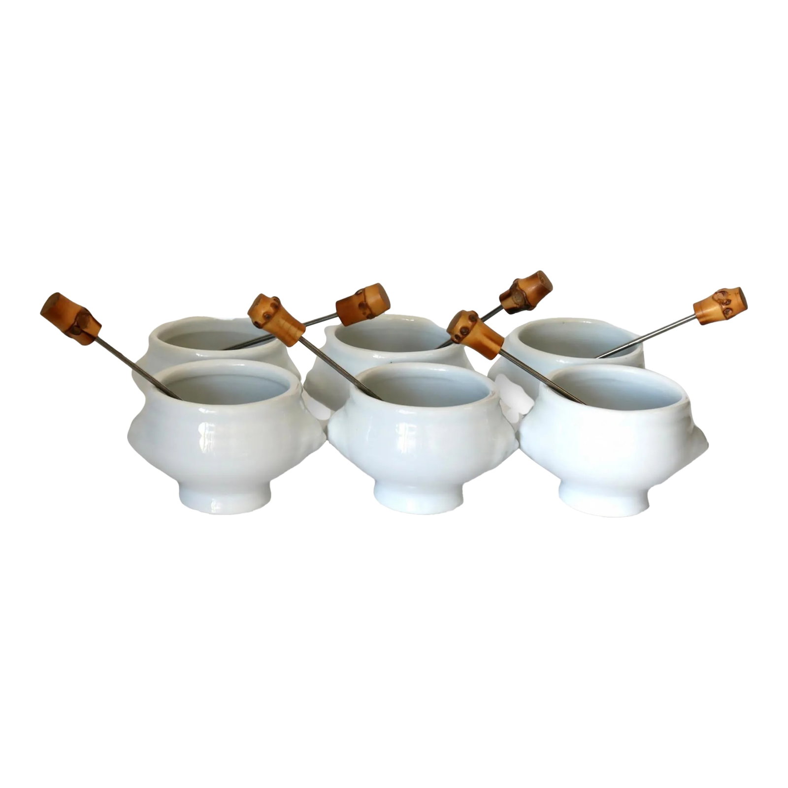 Midcentury French French Pot Au Chocolat Set, 12 Pieces: The pot au chocolat, a classic French dessert of warm, decadent chocolate, takes center stage in this set, and adding a unique and playful touch to the pot au chocolat vessels are the intricately desi