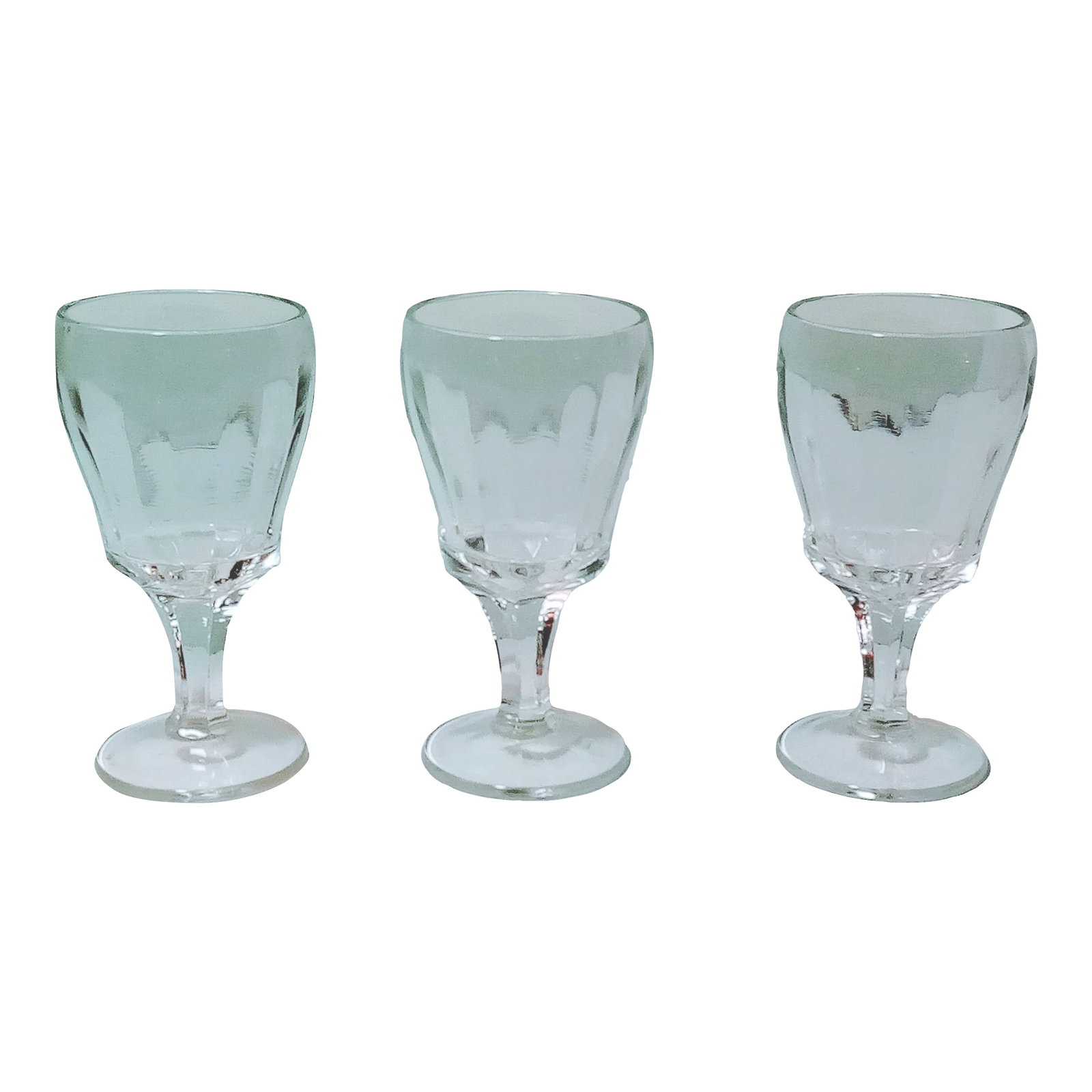 1950s Vertical Optic Tulip Design Cordial Glasses- Set of 3: Three clear vertical paneled cordial glasses made in the 1950's. I'm not sure of the maker. They are 5"tall 2.5" wide and 3" deep. Mint condition. An unusual set! Condition: Alterations: Original Cond