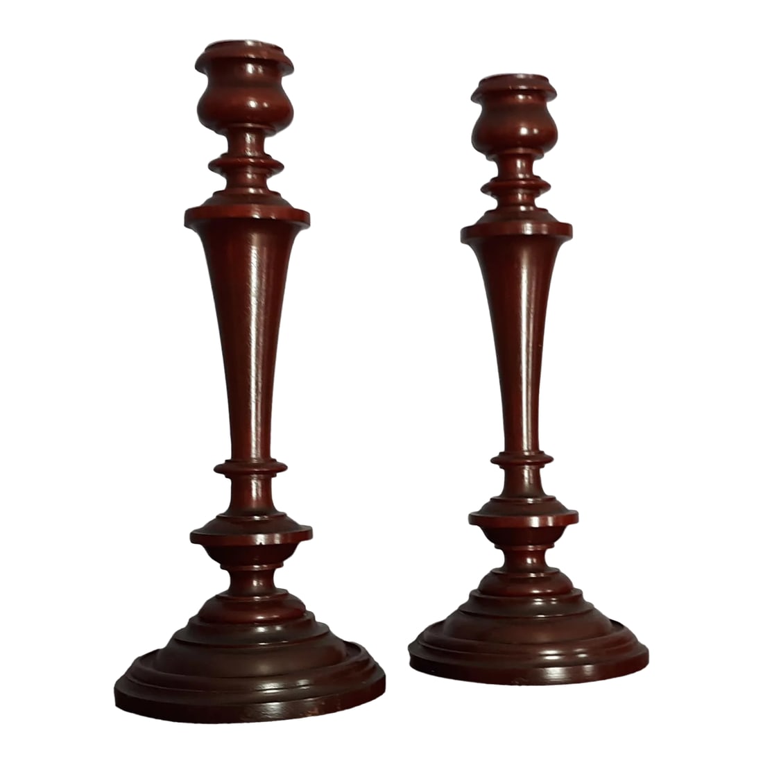 Mid 20th Century Tall Handcrafted Wooden Spindle Styled Candlestick Pair: This lovely pair of handcrafted wood candlesticks are a foot tall. Great for those intimate dinners. Beautiful enough to stand alone or in an arrangement. The pair has a nice symetrical design that na