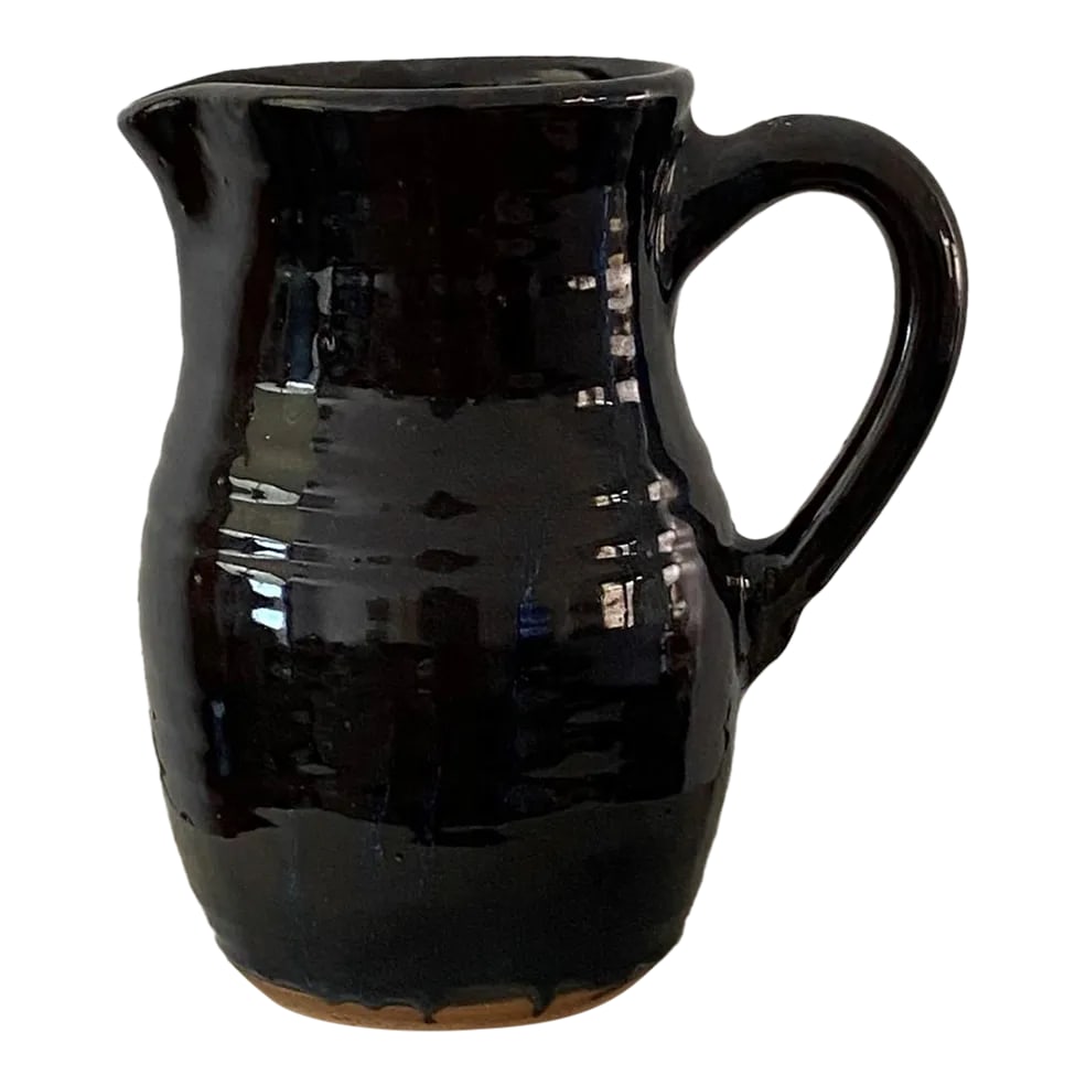 Vintage 1990s Peppertown Pottery Ceramic Pitcher: Beautiful 1999 Peppertown Pottery ceramic pitcher. Hand made, dark brown with streaks of blue (from afar almost looks black). Pitcher: 9"W x 6"D x 9.25"H Condition: Alterations: Original Condition
