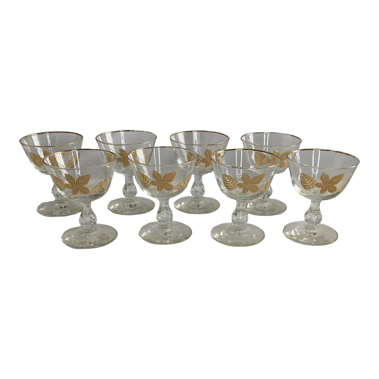 Vintage Golden Leaves Glasses, Set of 8: This beautiful set of eight Golden Foliage dessert glasses captures the sophistication of mid-century entertaining. Each clear glass features the signature Libbey gold leaf pattern and a delicate