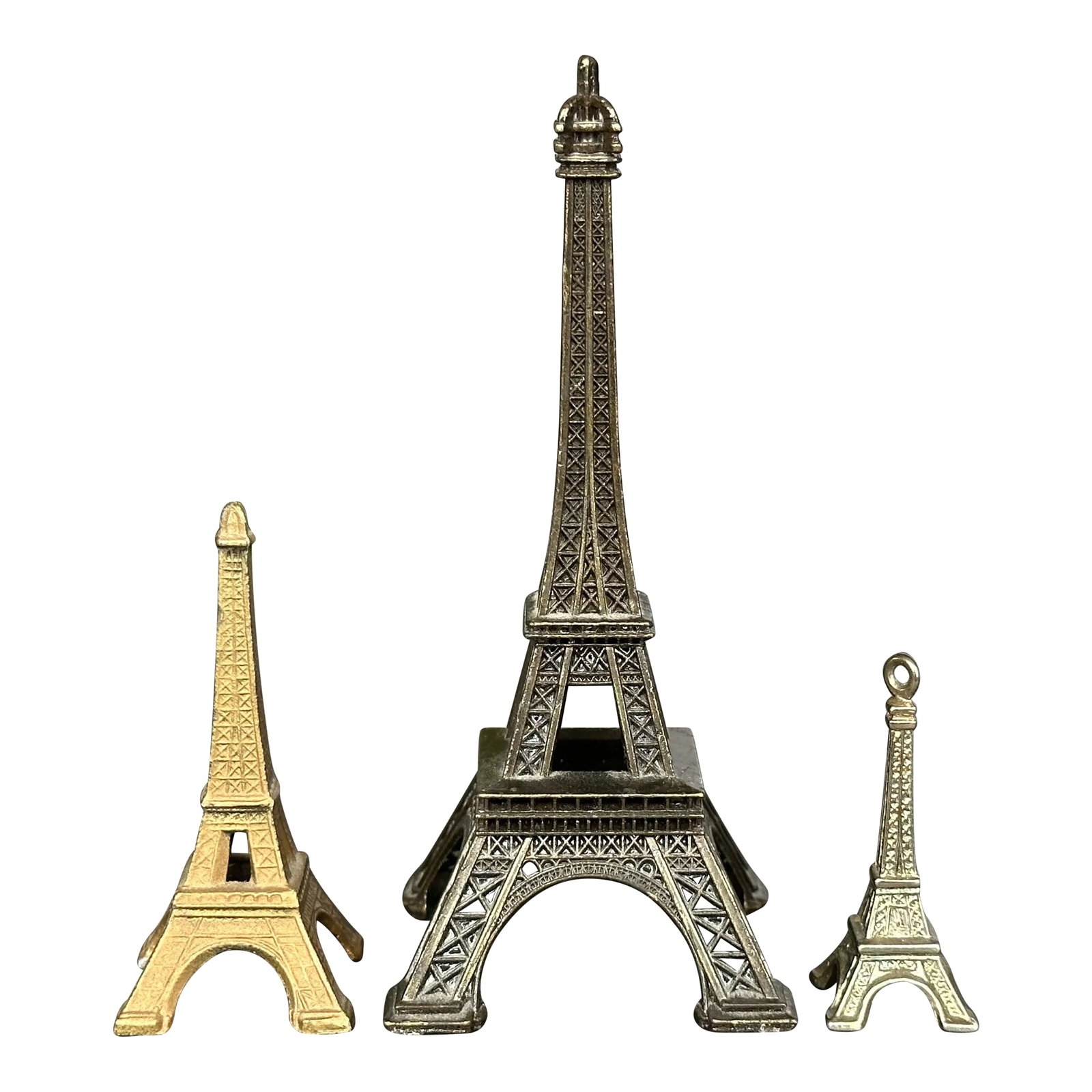 Eiffel Tower Architectural Monument Model Set of 3: This set of vintage Eiffel Tower monument models will add a touch of je ne sais quoi to your living room or home office decor. Display the trio of vintage travel souvenirs on a shelf, console table, o