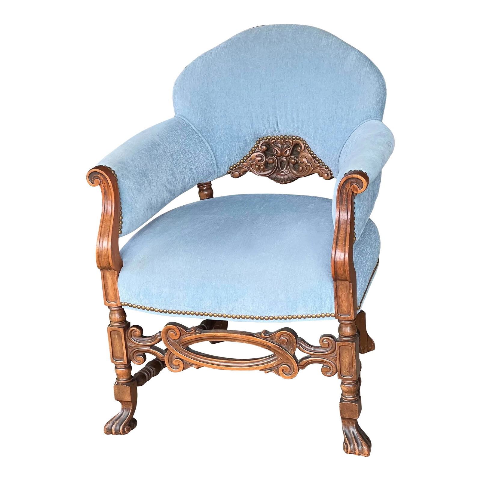 Antique Carved Wood Upholstered Arm Chair C. 1920: This is a Victorian-style upholstered armchair, likely dating to the late 19th century (circa 1870-1890). The chair features: *Carved Walnut Frame: The arms, front stretcher, and legs are elaborately