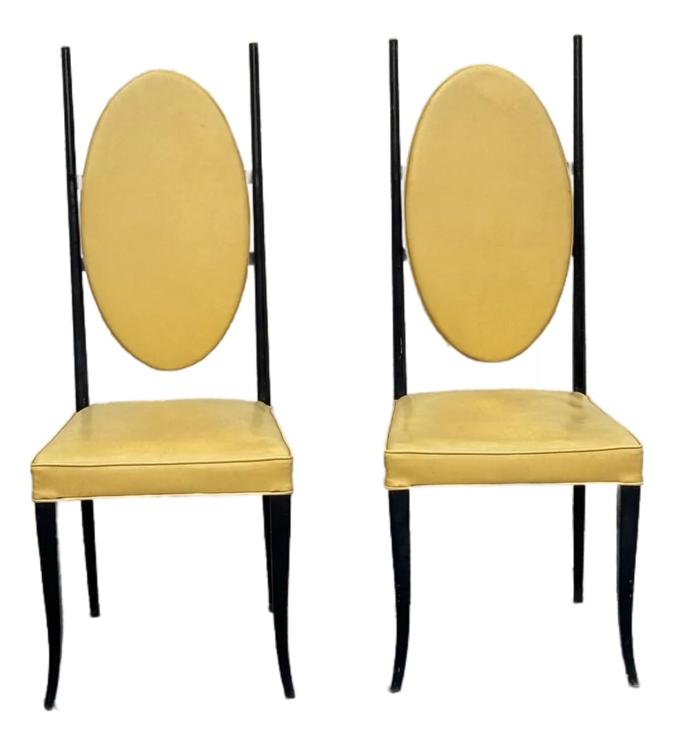 Pair of 1970s Italian Modern High-Back Sculptural Chairs: Pair of Italian modern chairs constructed with black painted wooden frames and upholstered in yellow leather. Each chair features a tall, sculpted backrest with an oval leather panel and a fitted leat