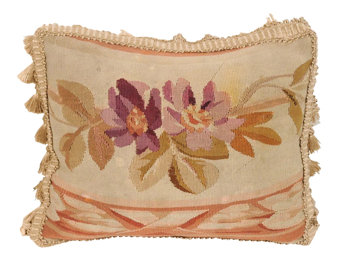 19th Century French Aubusson Tapestry Pillow: A French 19th century Aubusson tapestry pillow, with floral decor and tassels. Born during the 19th century in the Aubusson tapestry manufacture located in central France, this pillow features two