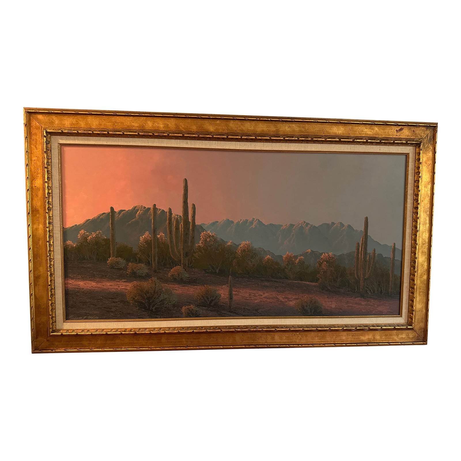 1960s Russell E. White Deseret and Mountain & Desert: Russell E. White, An American western desert with Cactus at sunset and mountains beyond, oil on board, signed. Frame is 57" x33". Condition: Alterations: Original Condition Unaltered Imperfections: So