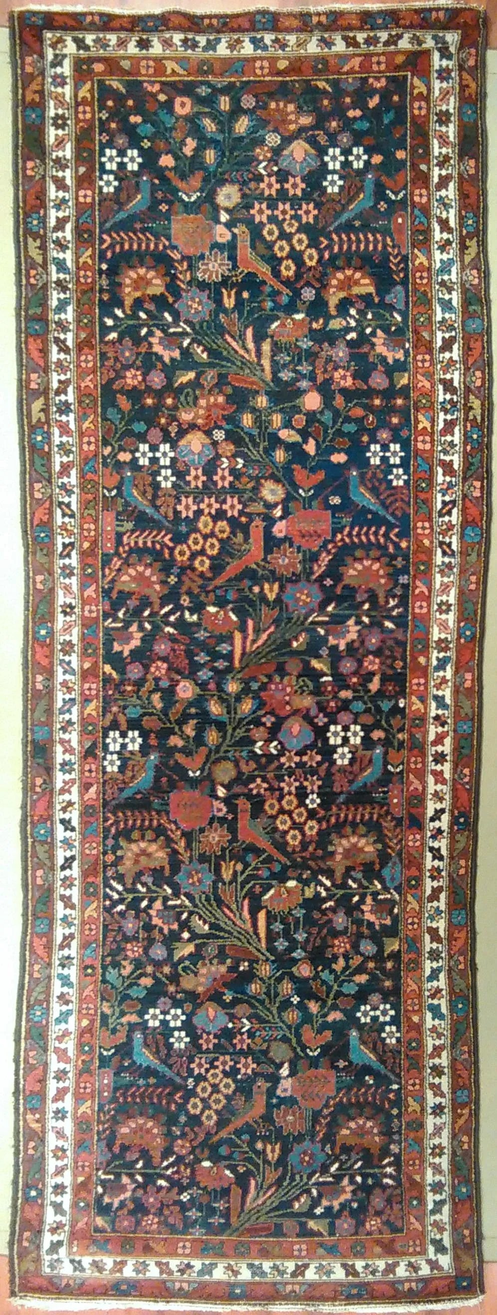 Antique Persian Mehraban Rug - 3'4" X 9'6": Rug #533 - Antique Persian Mehraban Origin: Persia Size: 3'4" x 9'6" Design: Birds of Paradise Material: Wool Primary Color: Blue Secondary Color: Rust Description: Antique Persian Rug Condition: Alte